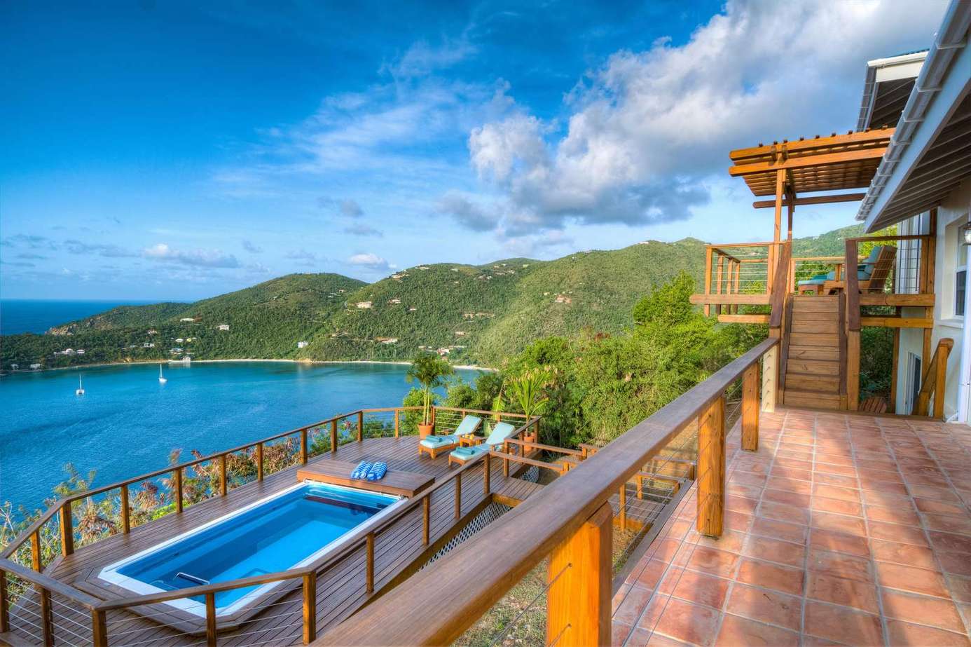 Spacious balcony with panoramic ocean and hillside views