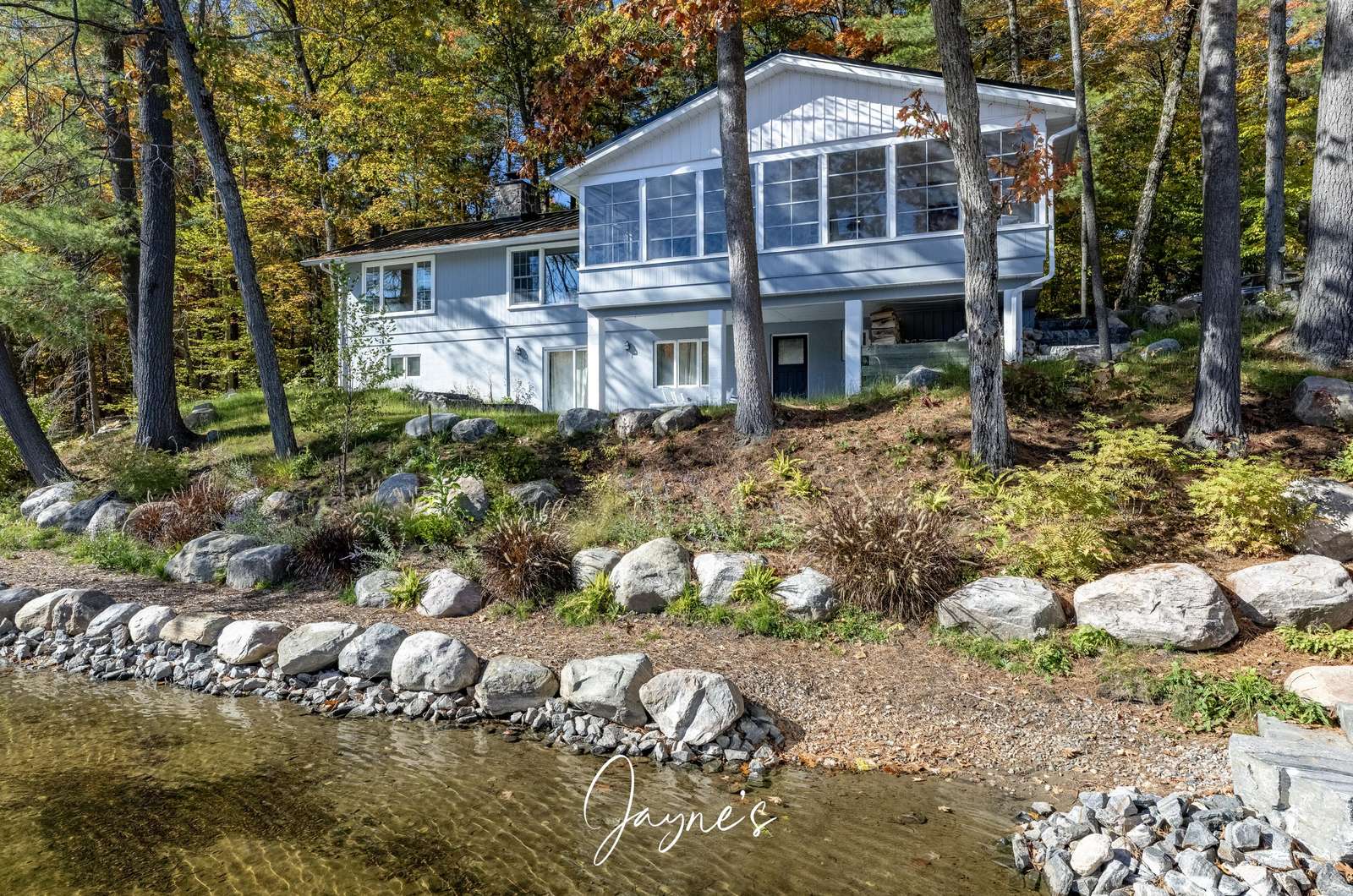 Lakeside retreat with spacious deck and serene water views