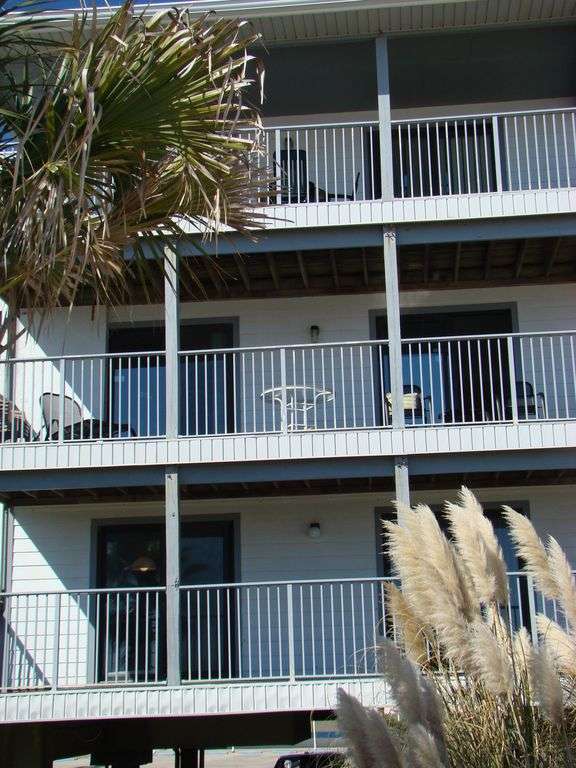 Close-up - Second floor double balcony overlooking beach and gulf.