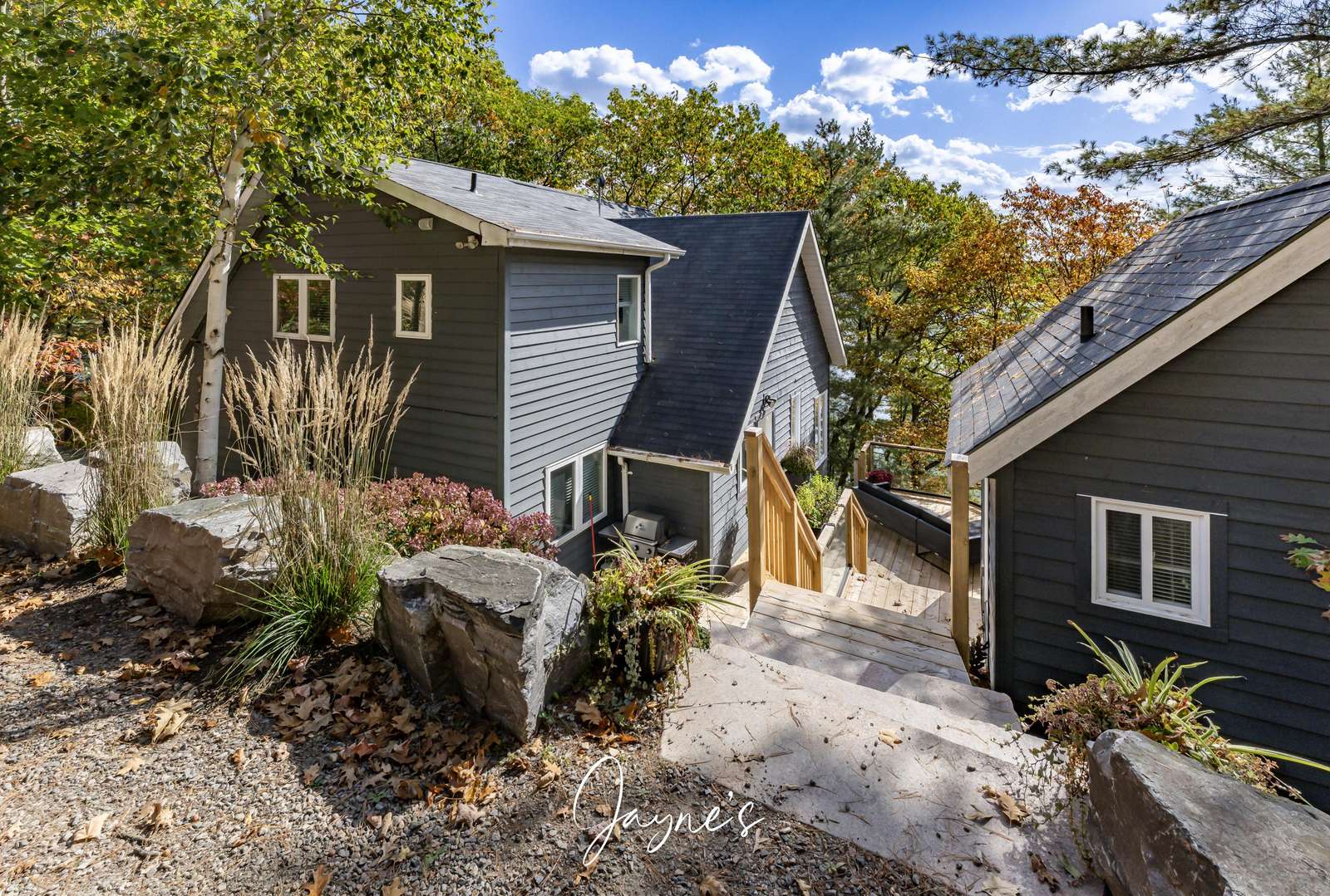 Charming cozy cabin retreat nestled among natural stone pathways