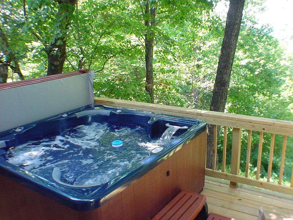 Private six-person hot tub on a deck in the tree tops.