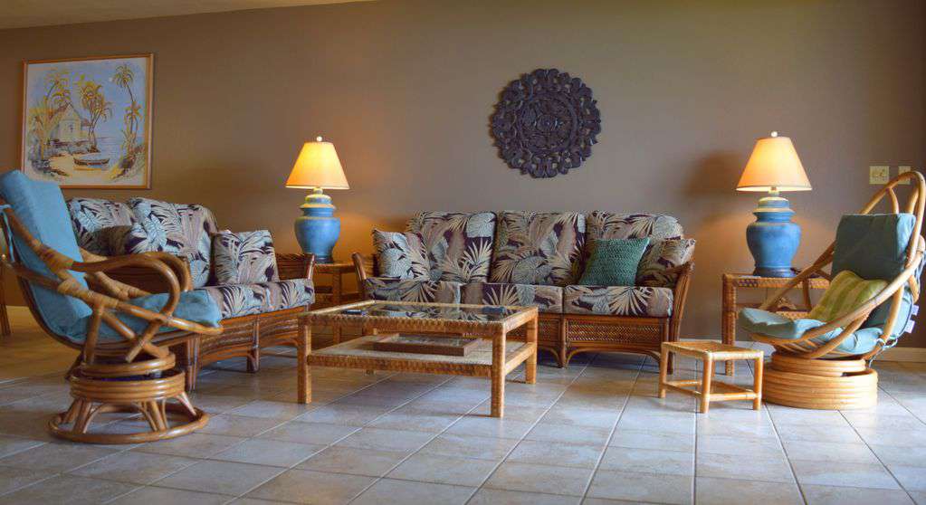 Spacious living area with new furnishings, TV, and ocean view.