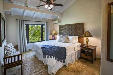 Cozy bedroom retreat with natural light and serene views