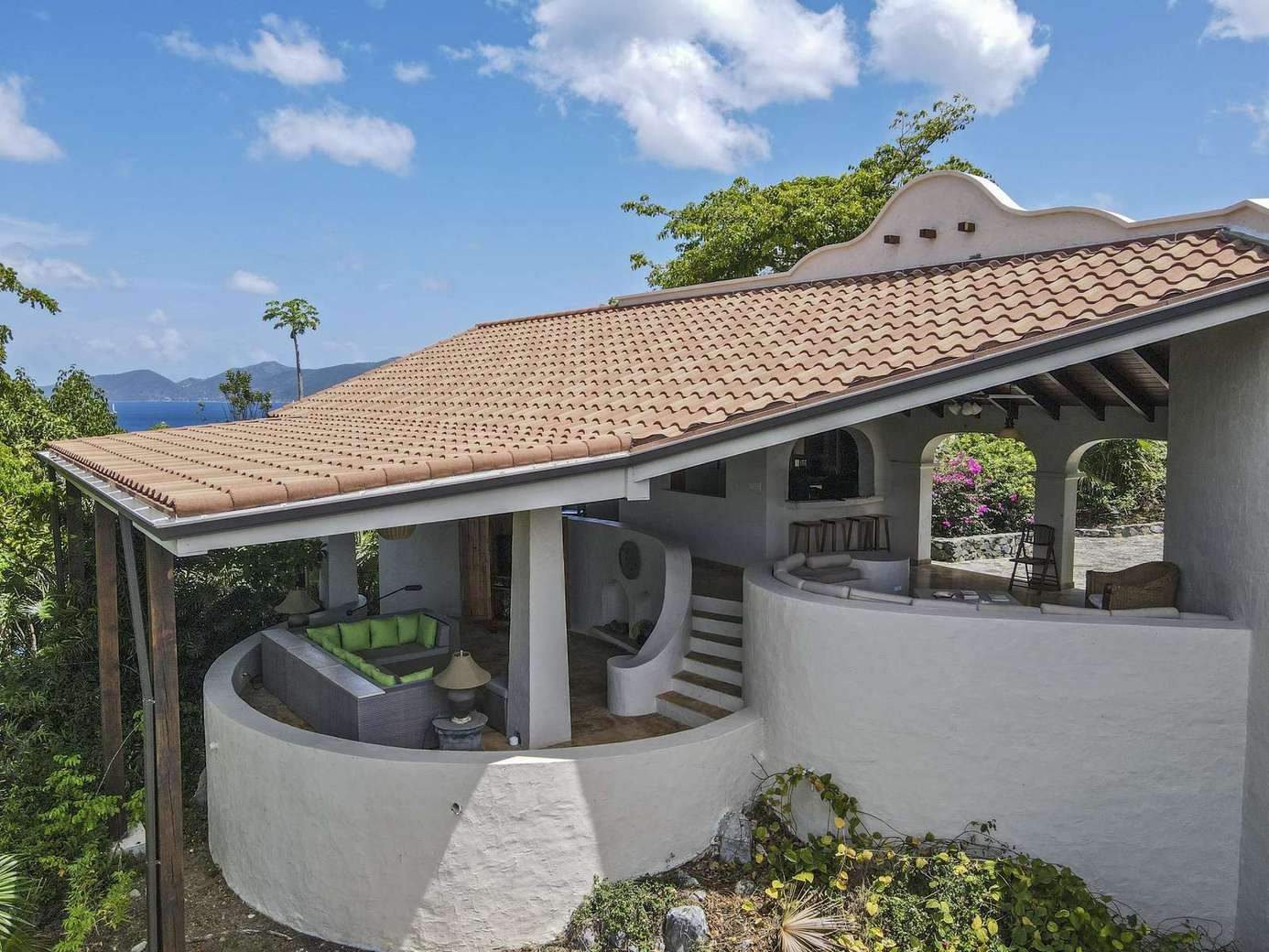 Spacious outdoor patio with panoramic mountain views and cozy seating