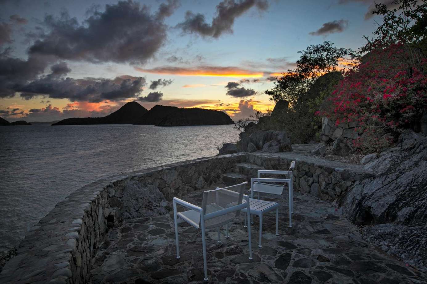 Secluded cliffside patio with breathtaking sunset views