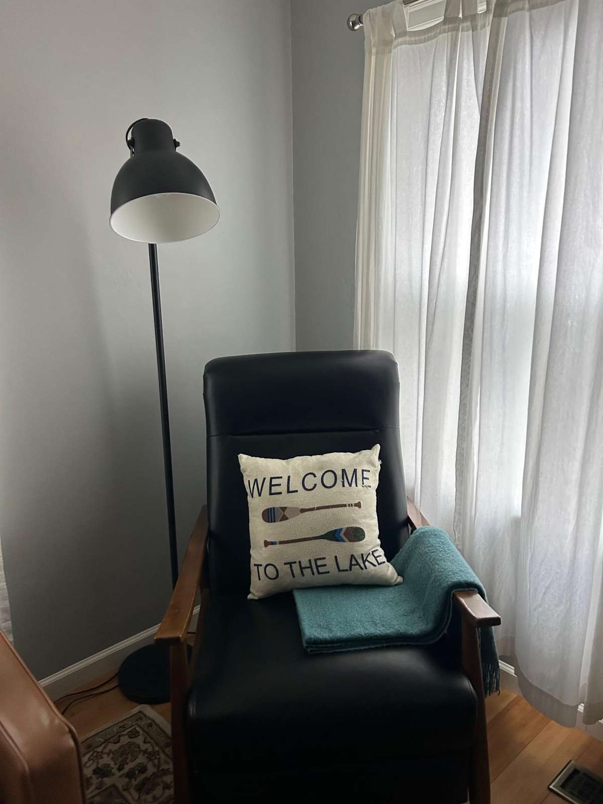 Cozy reading nook with soft natural light and plush chair