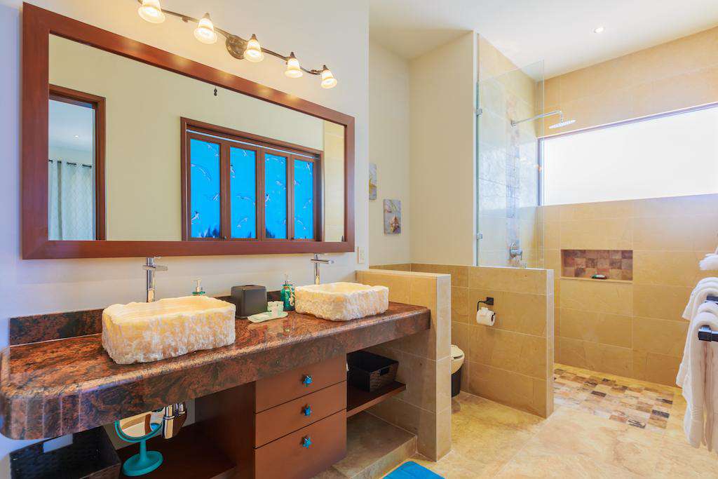 Large walk in showers and his and her sinks in each ensuite