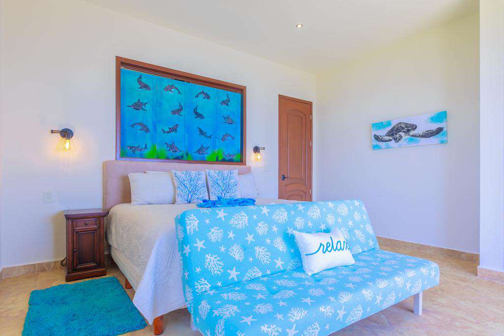 King Bed, with local Batik art between the ensuite and bedroom