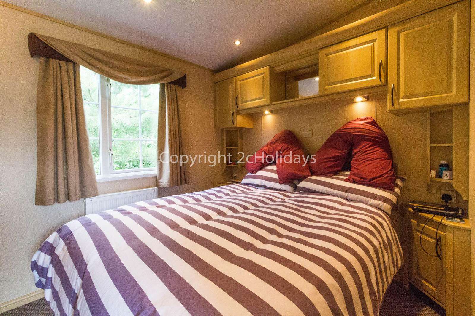 Large bedroom area in this great caravan for hire.