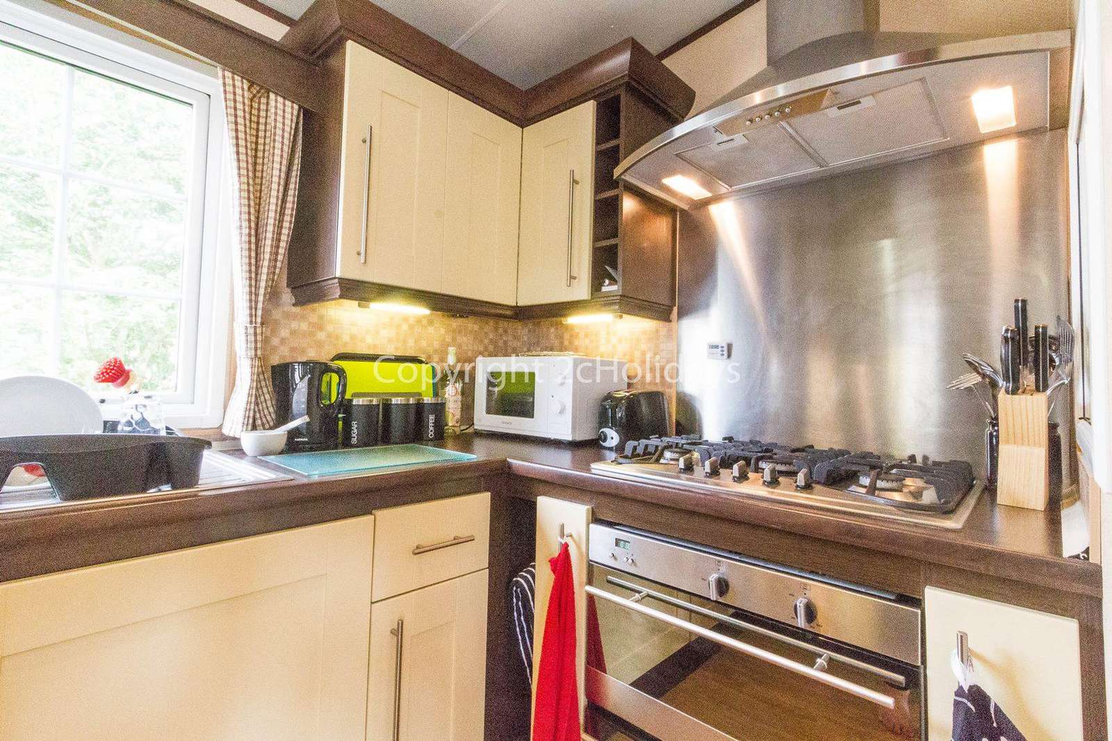 Fully equipped kitchen in this caravan for hire.