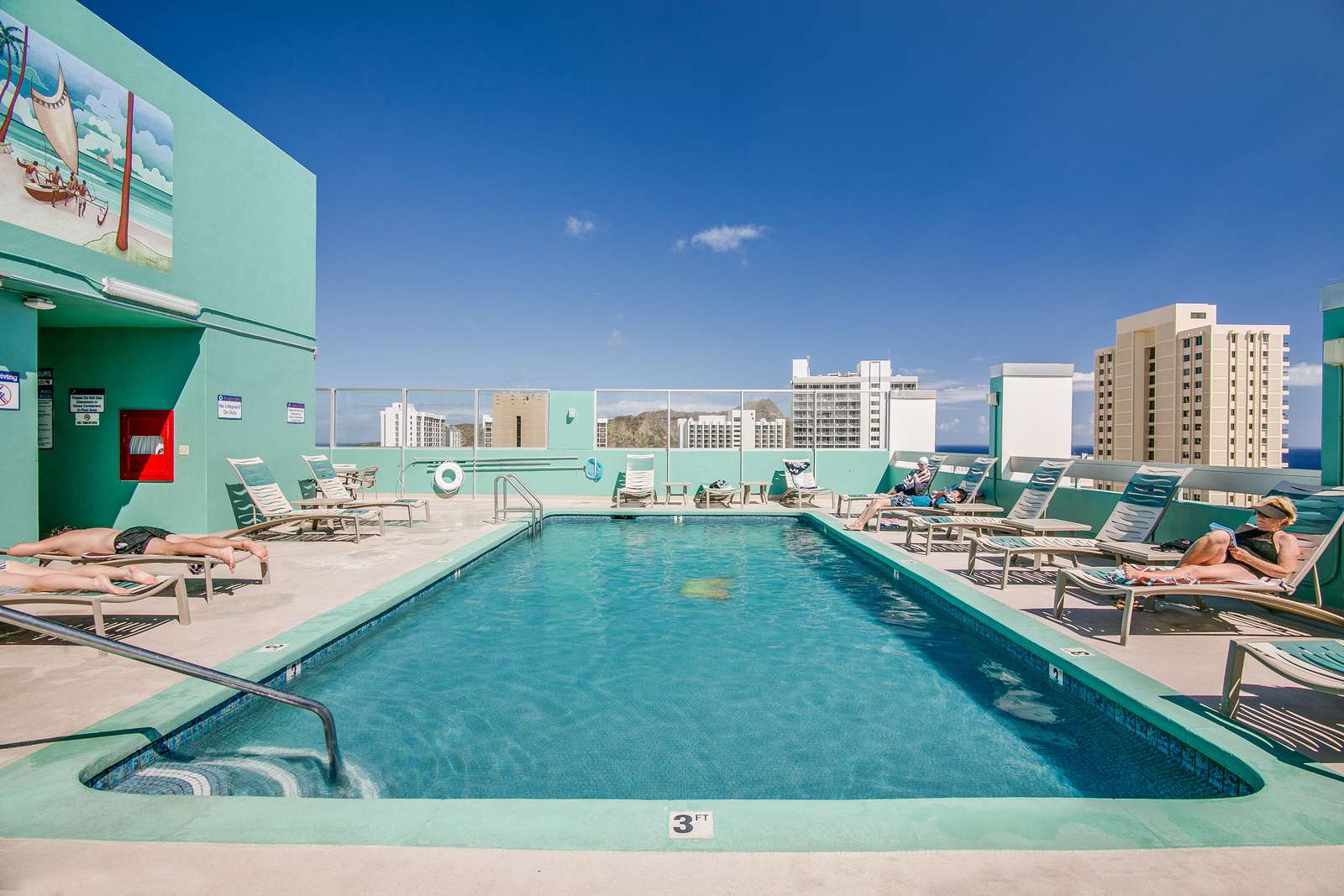 Large rooftop pool with ample sun loungers