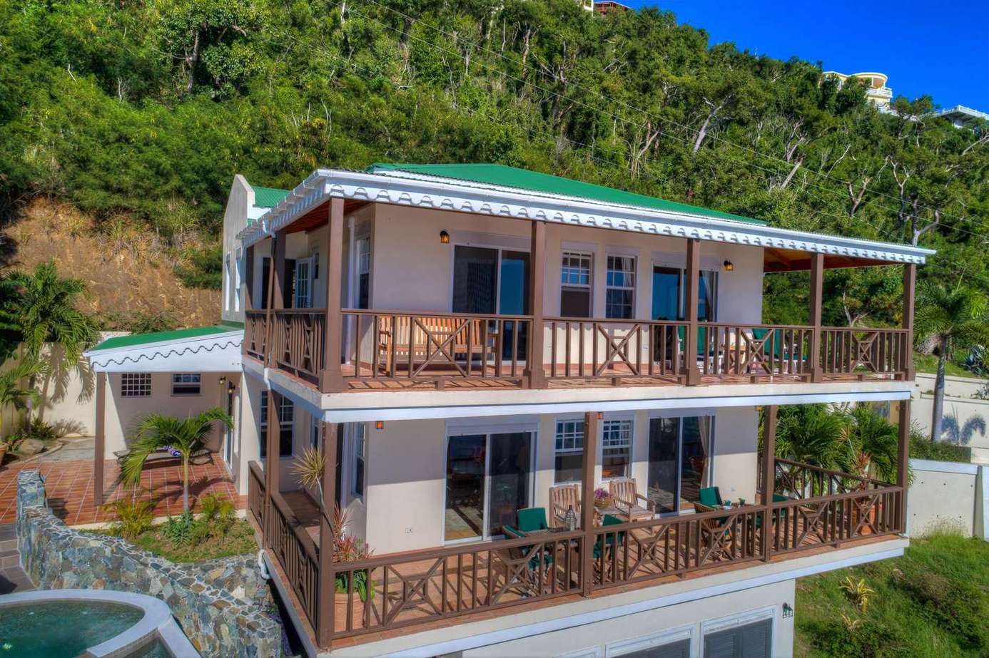 Spacious multi-level home with panoramic hillside views and wraparound balconies