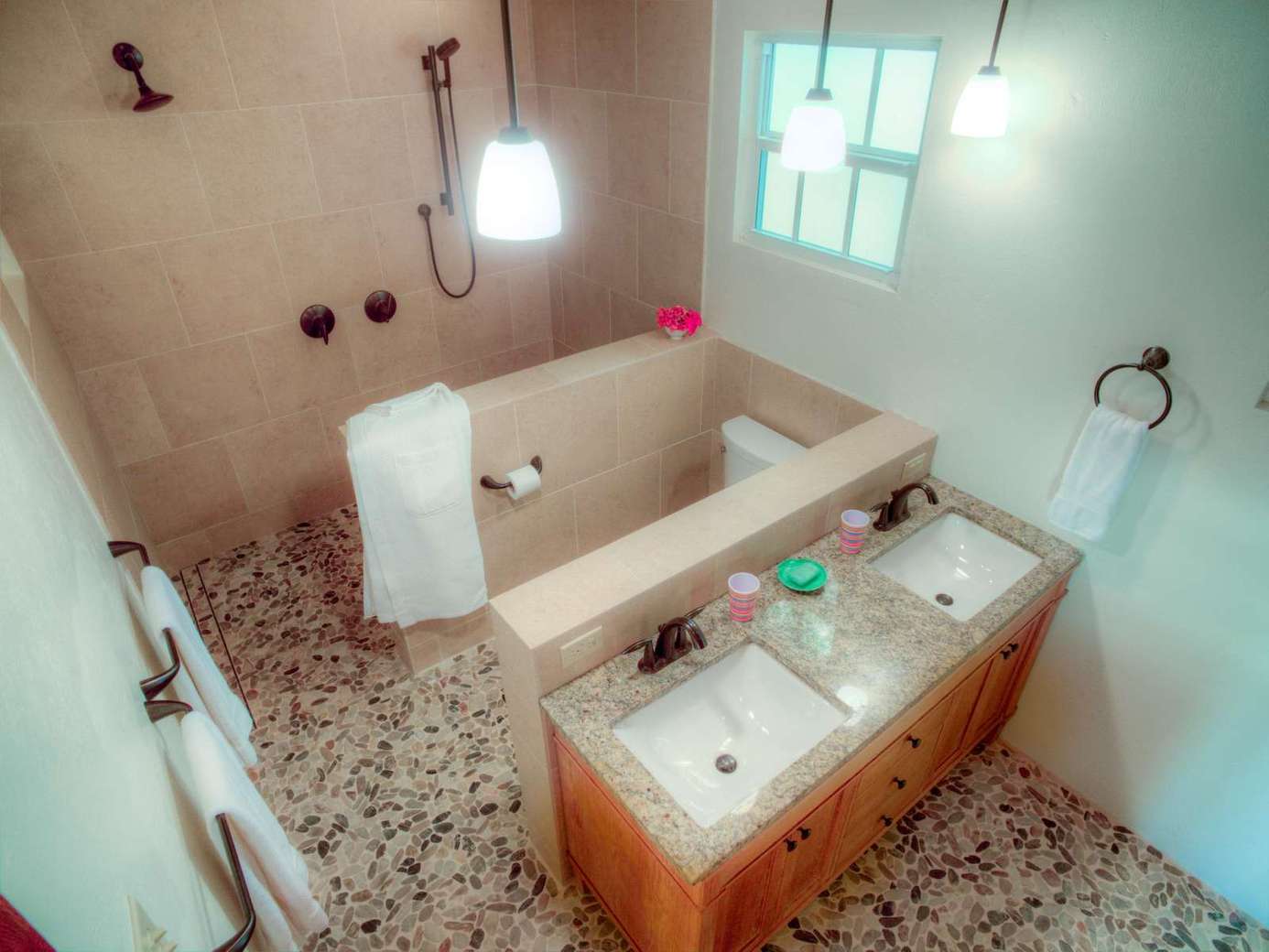 Cozy bathroom retreat with dual sinks and warm lighting