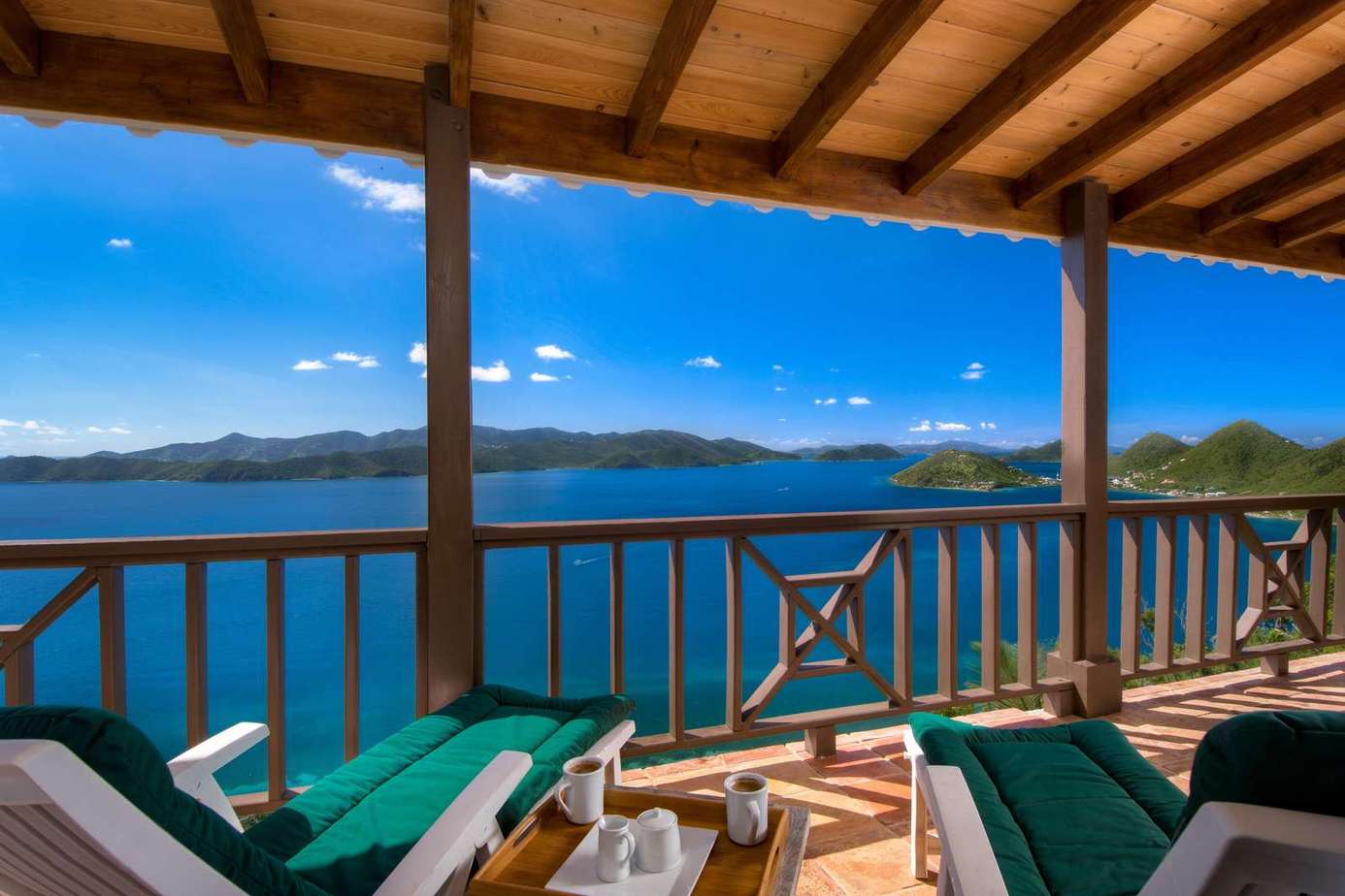 Relax on the spacious balcony with stunning lake views