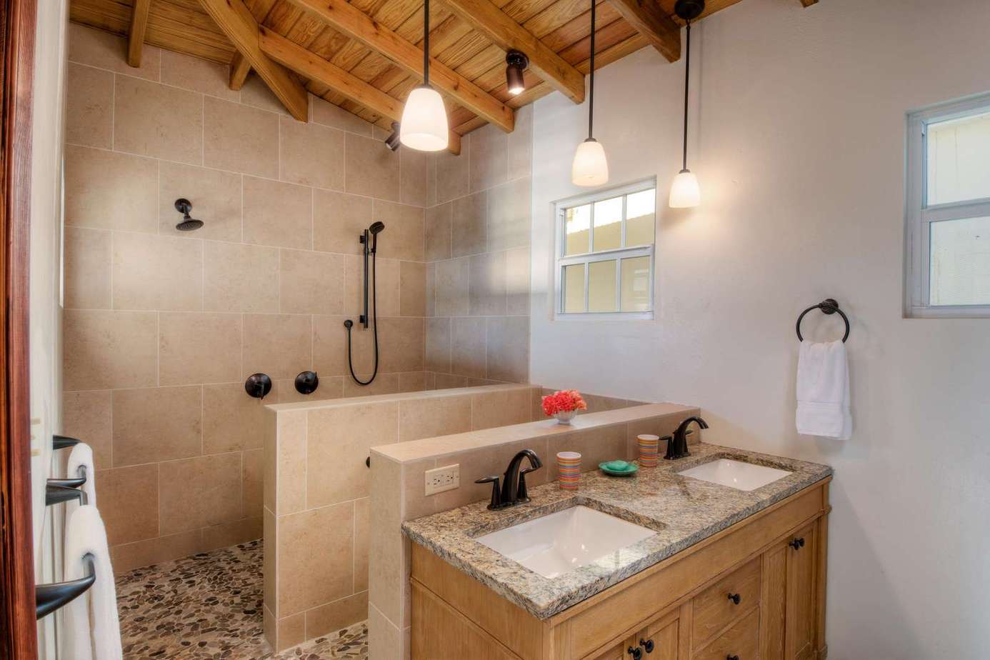 Rustic bathroom retreat with spacious walk-in shower and warm wood accents