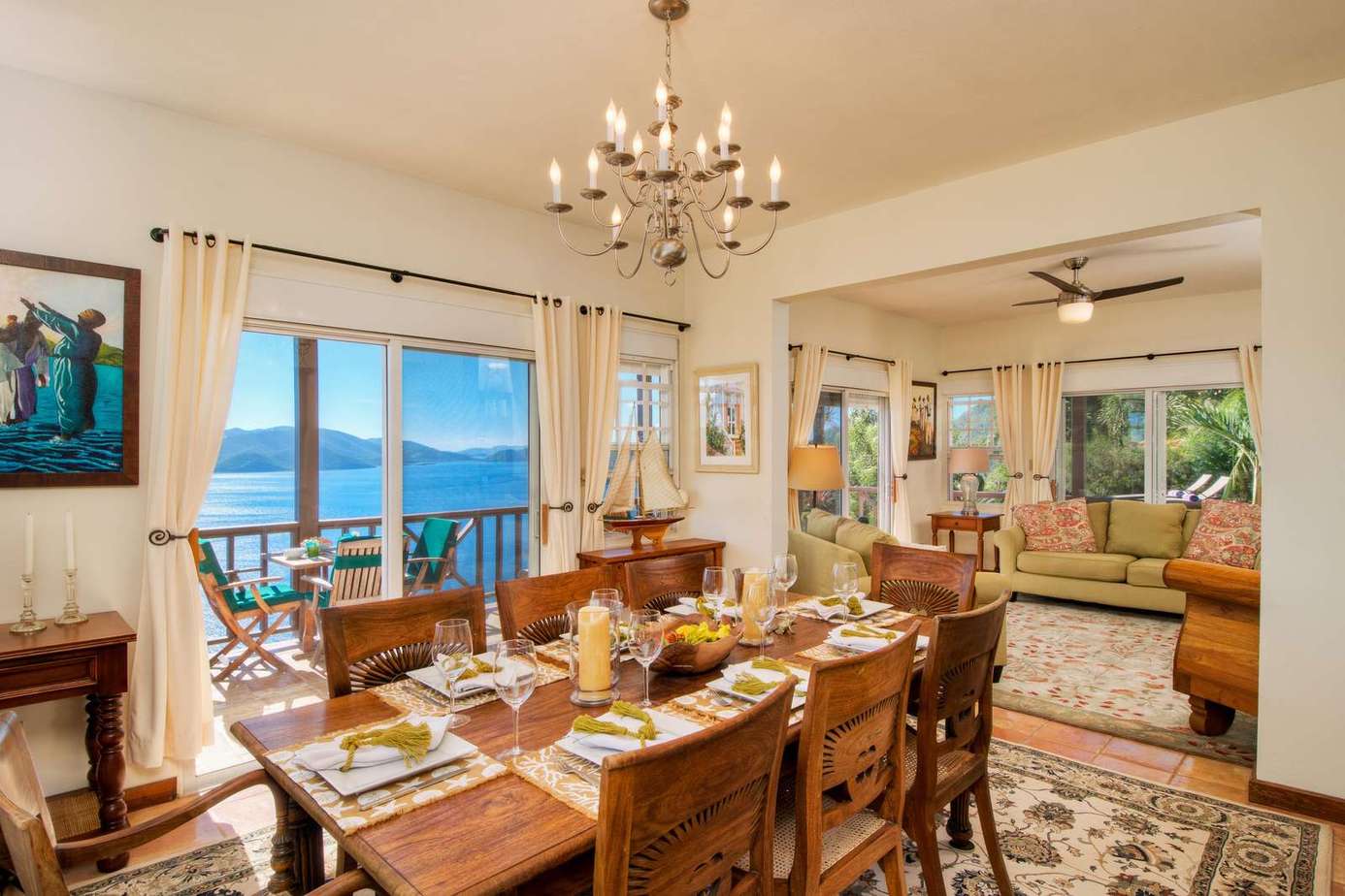 Spacious dining room with ocean views and elegant chandelier