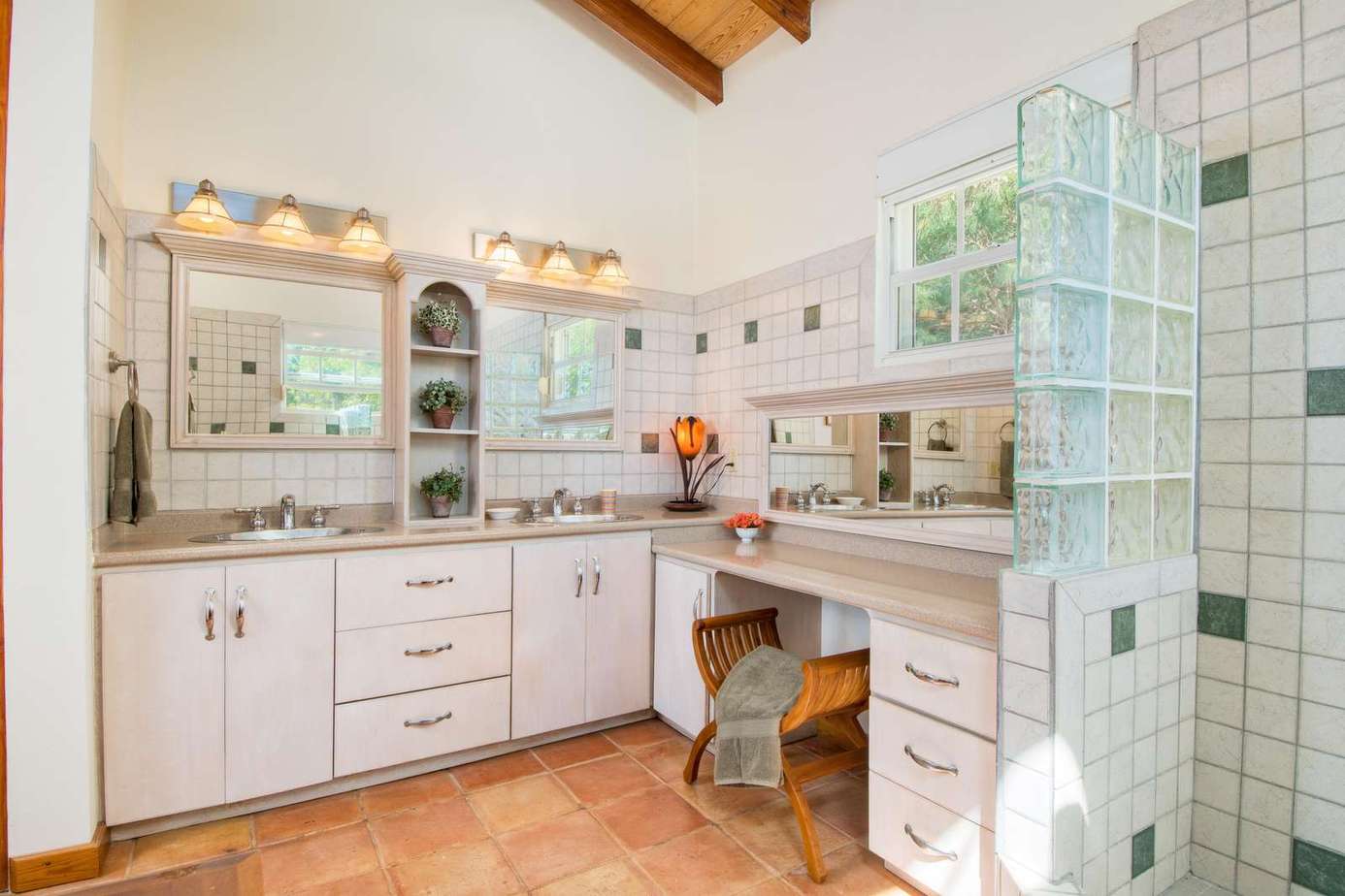 Bright, airy bathroom with spacious vanity and natural light