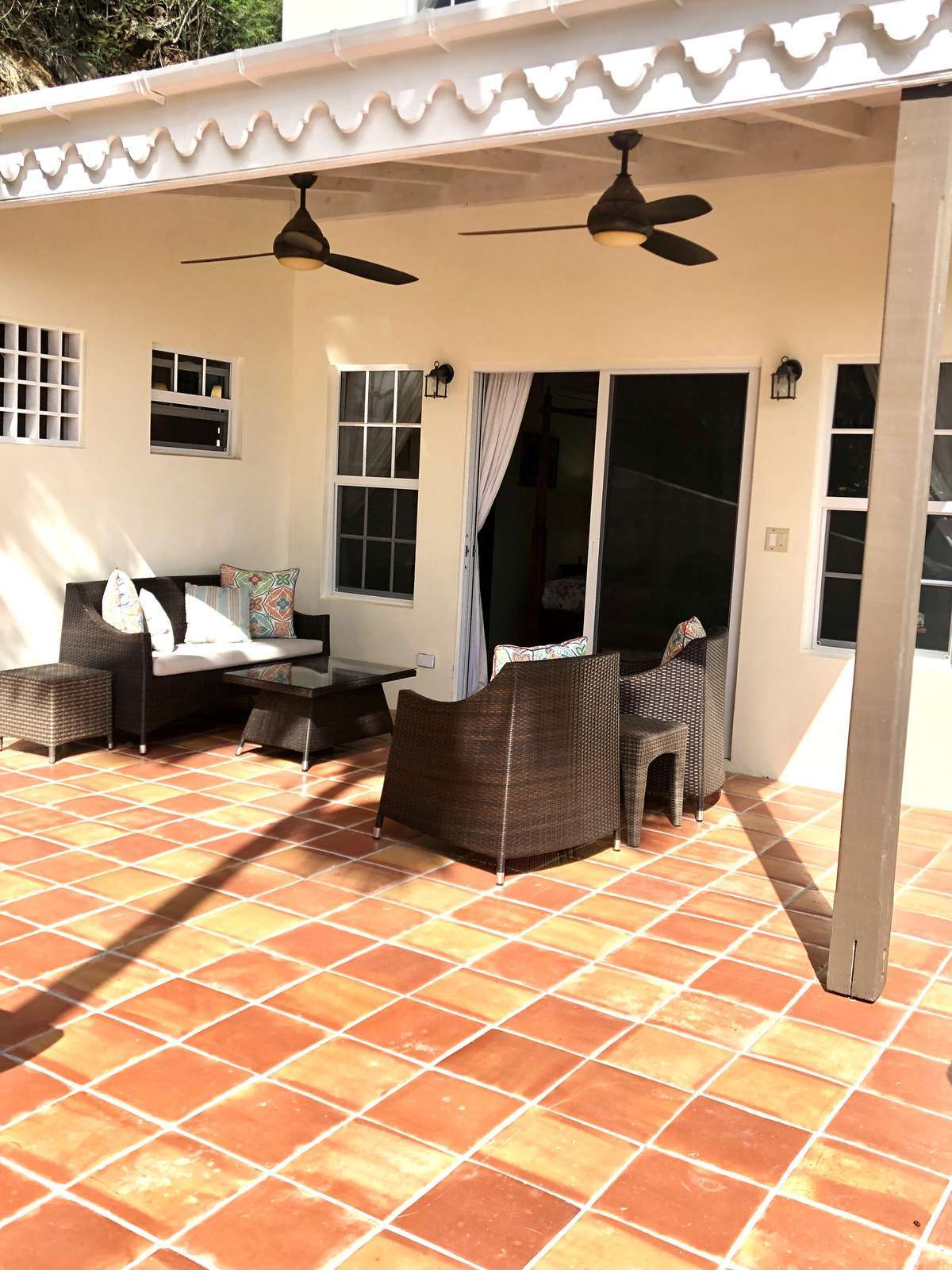 Spacious sunlit patio with cozy seating for relaxing gatherings