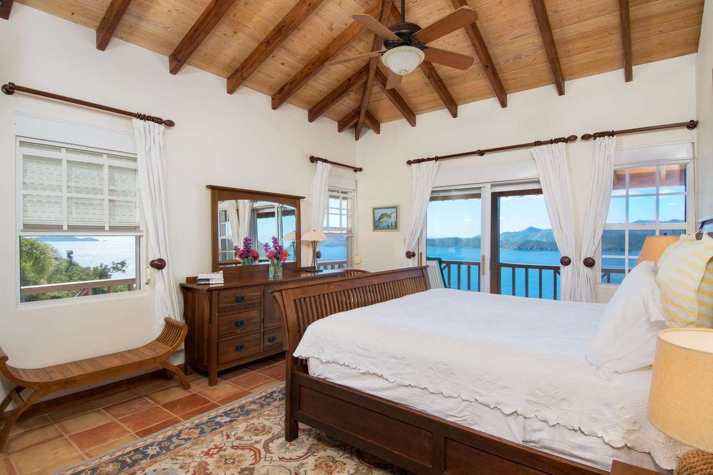 Spacious bedroom with vaulted ceilings and ocean views