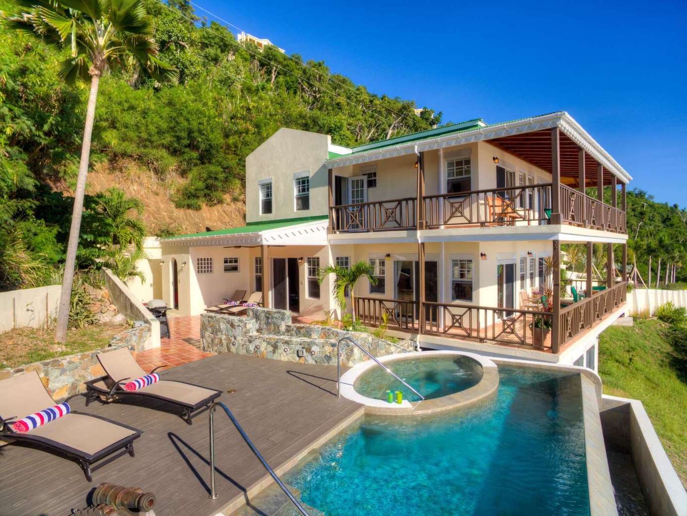 Spacious patio with pool and mountain views for ultimate relaxation