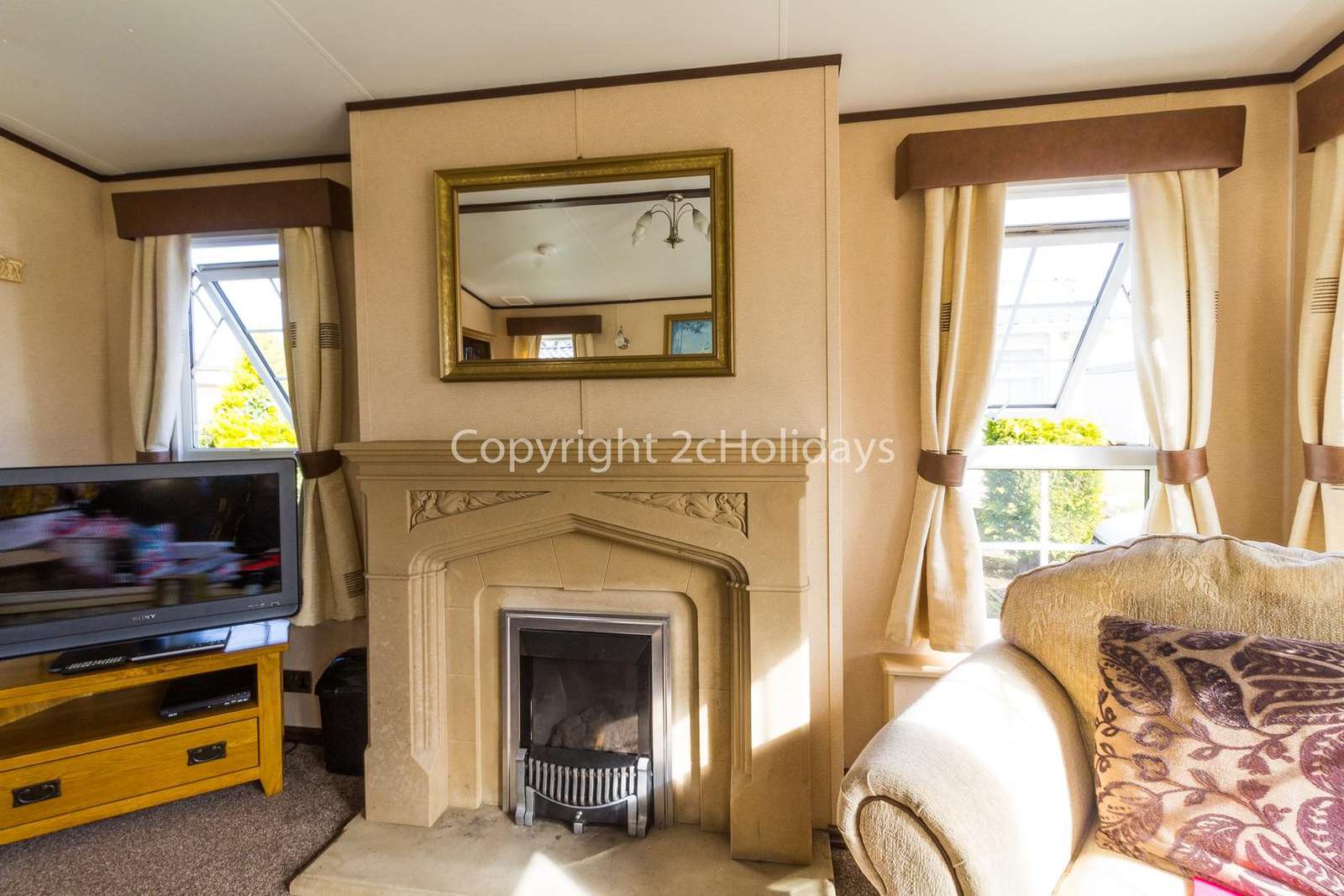 Homely feel to this lounge with a TV and gas fire!