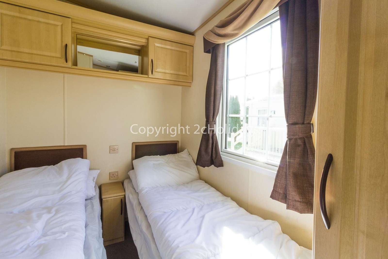 You can find a TV in this twin bedroom!