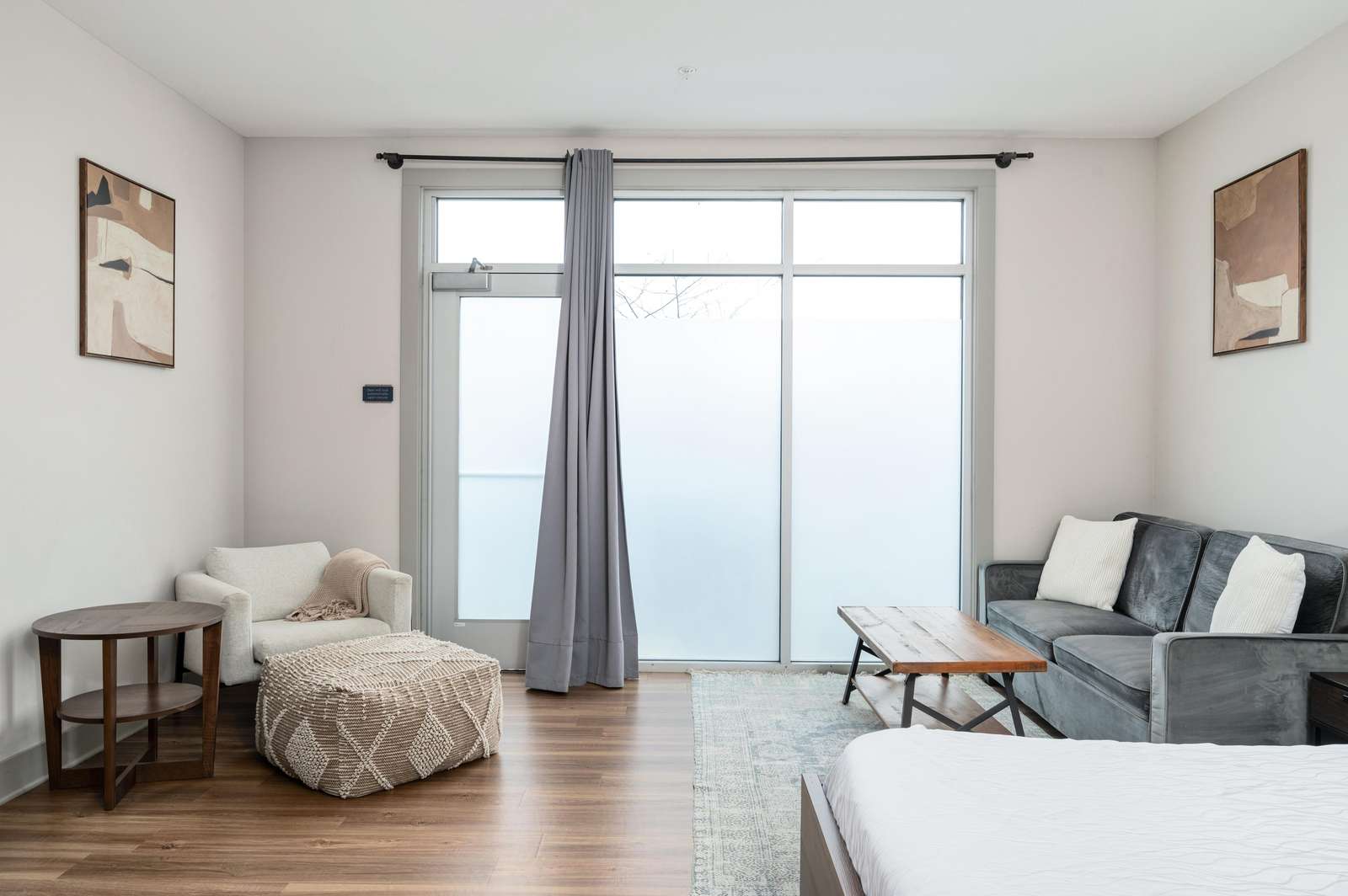 Bright and airy living room with cozy seating and natural light - property