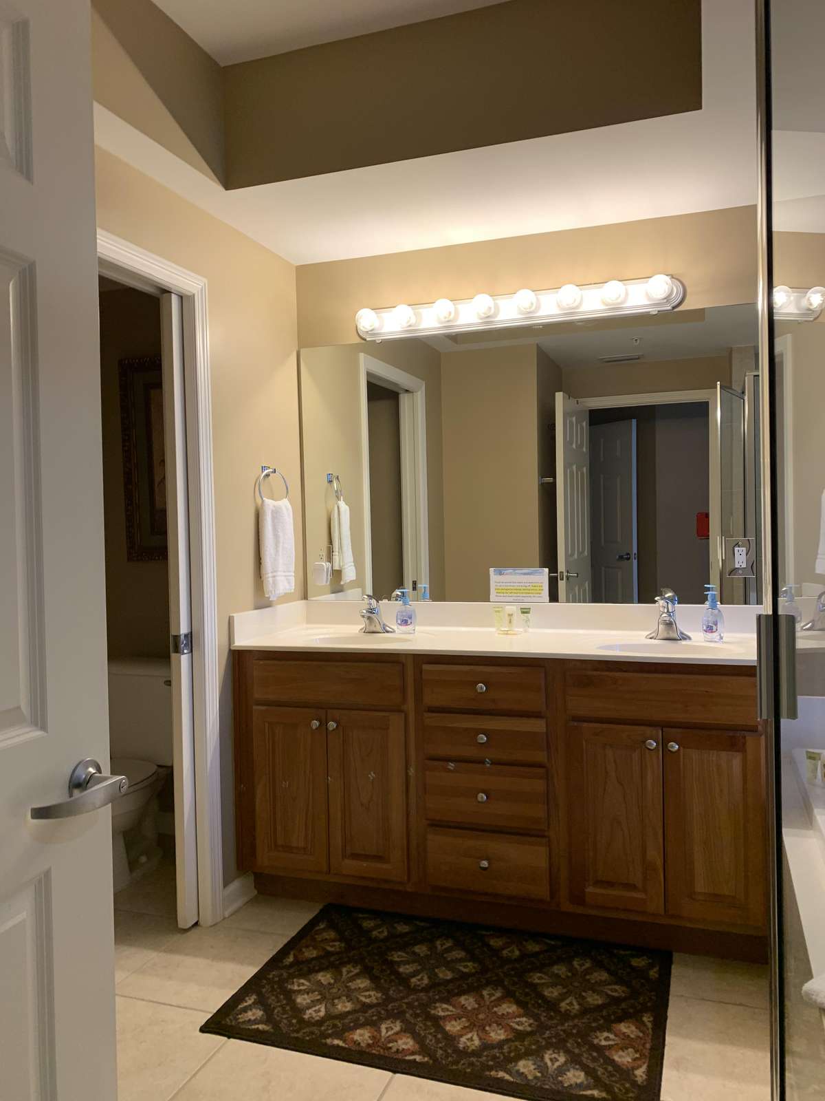 Master bathroom with double sinks and water closet
