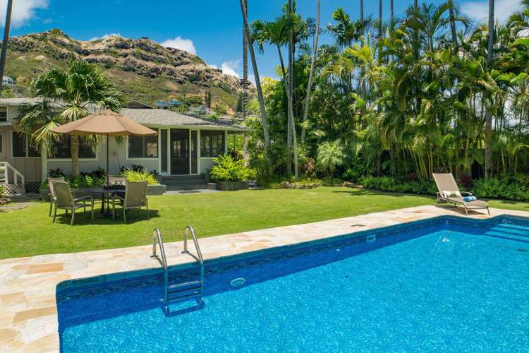 The entire property is surrounded by lush landscaping, beautiful palm trees. Preview 0