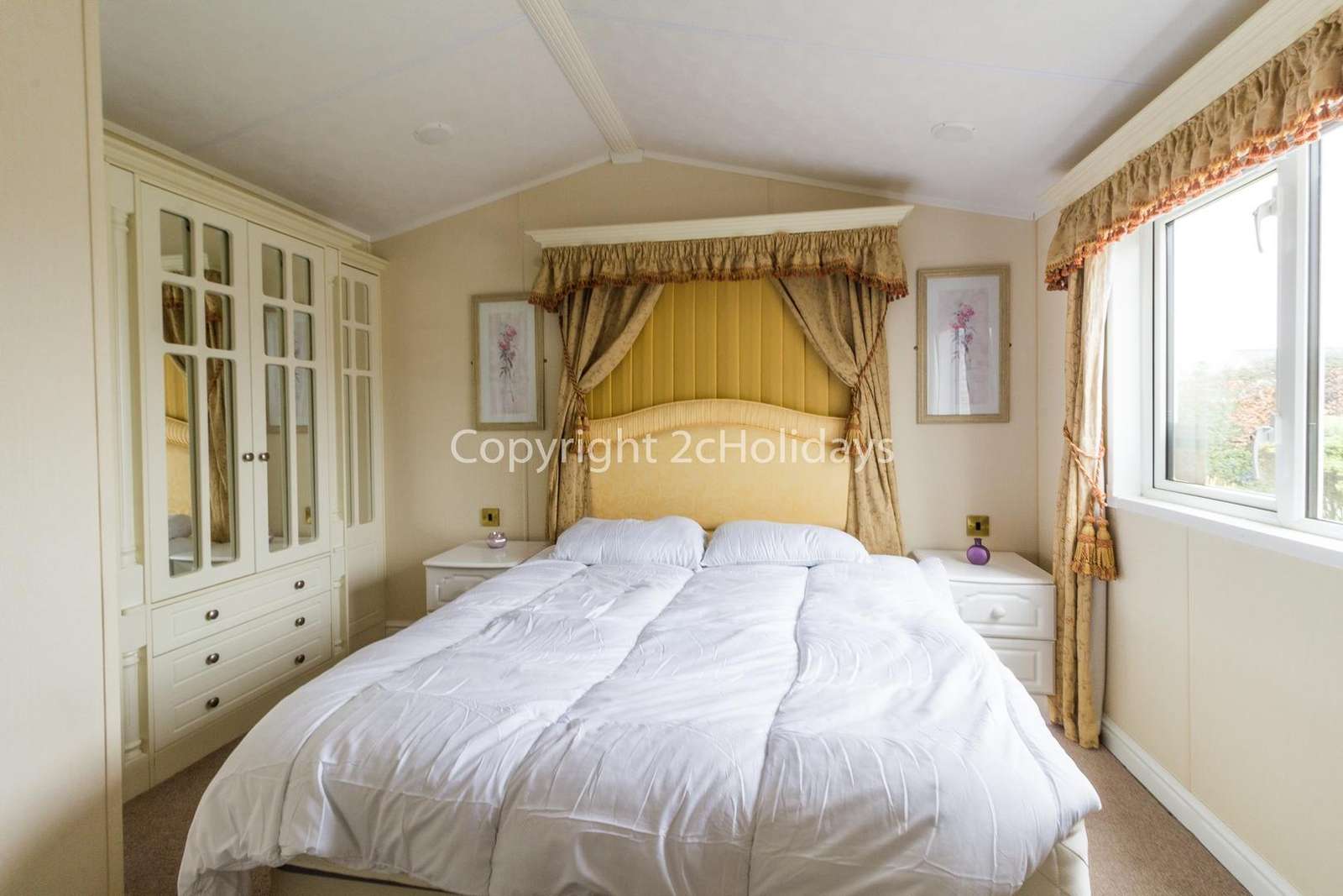 A stunning master bedroom with a TV
