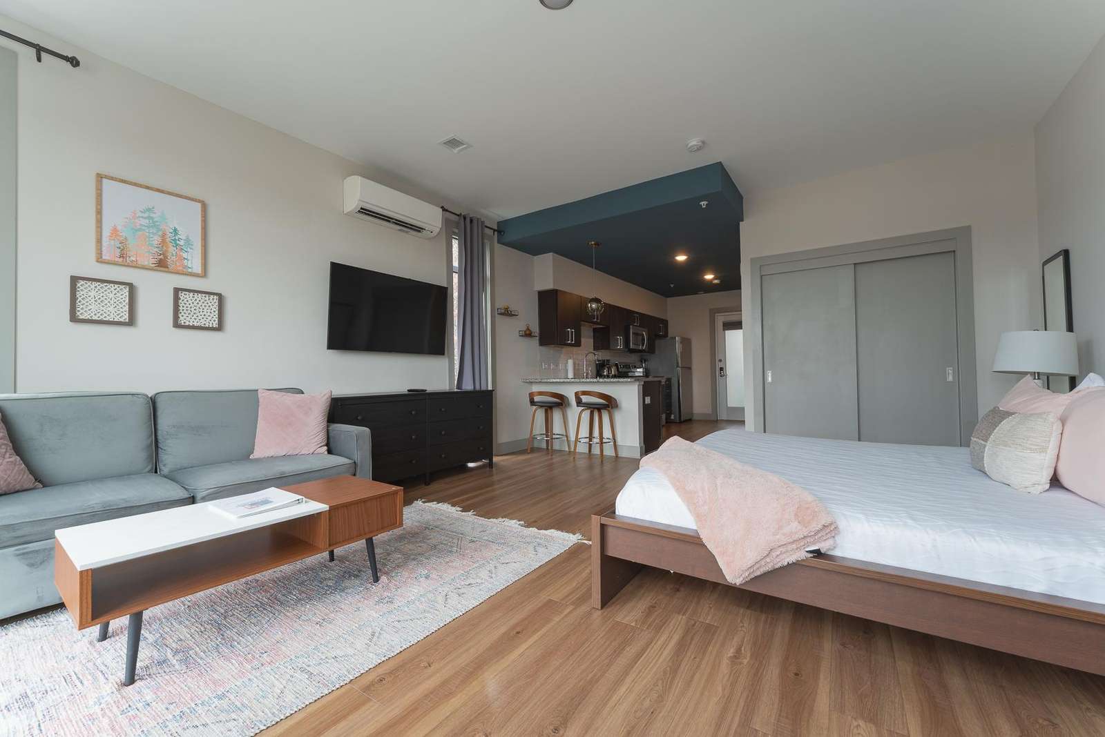 Bright open studio with cozy seating and modern kitchen - property