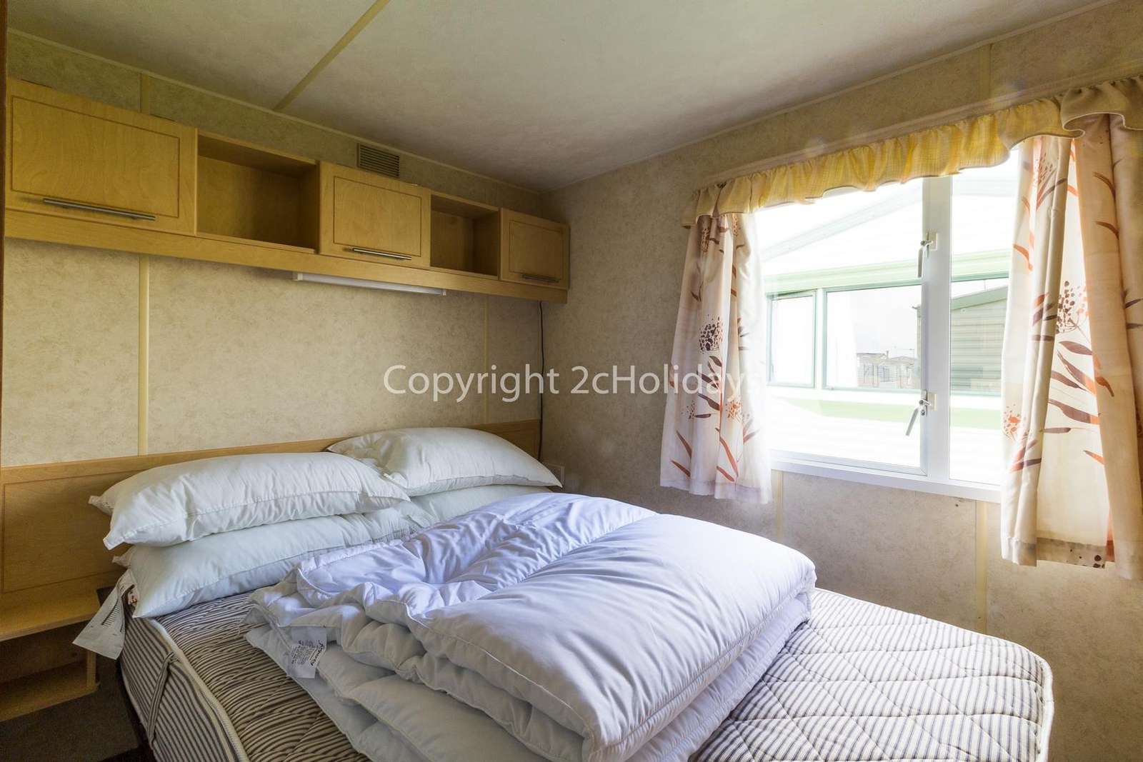 You can find plenty of storage space in this master bedroom!
