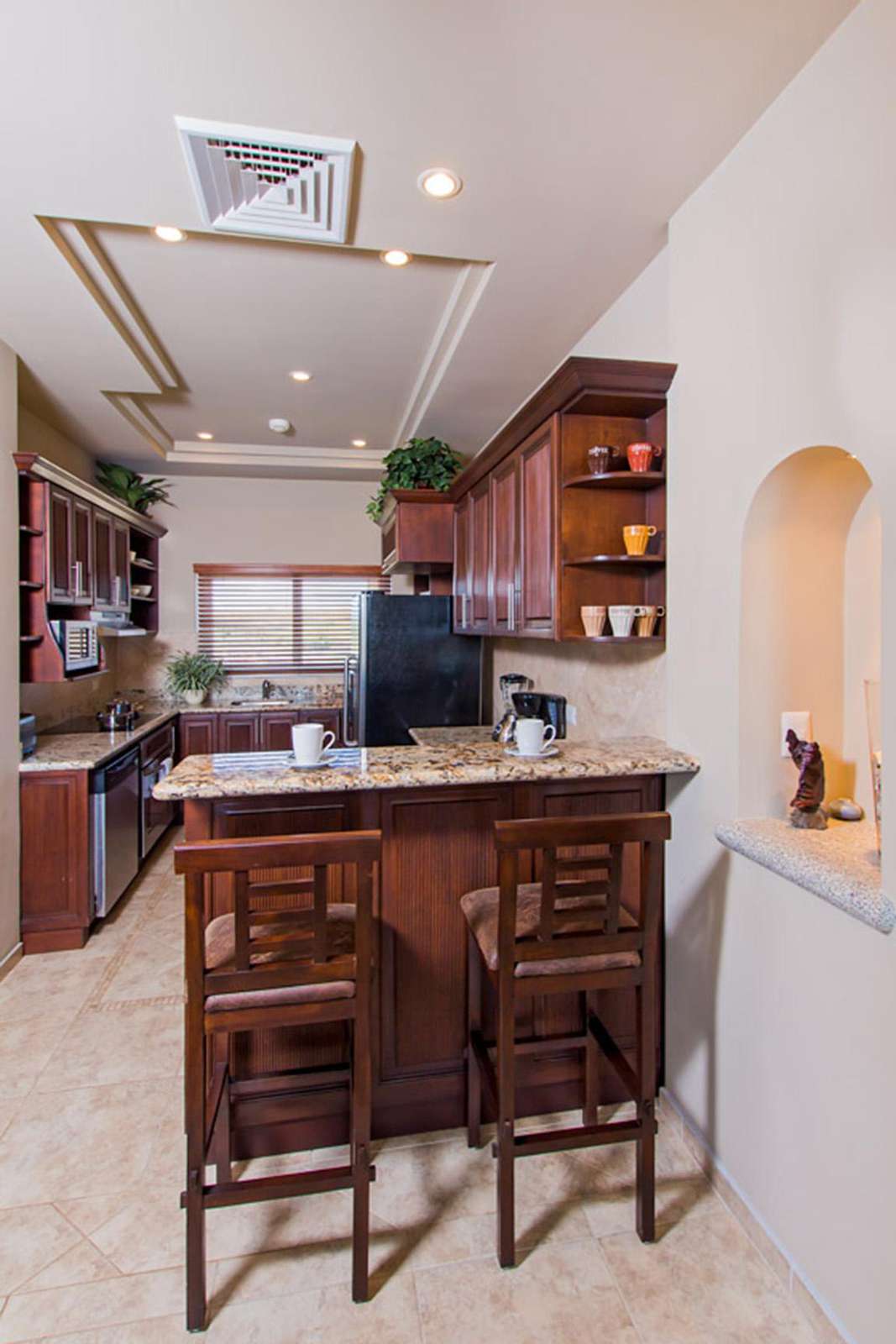 Another view of the kitchen and breakfast bar