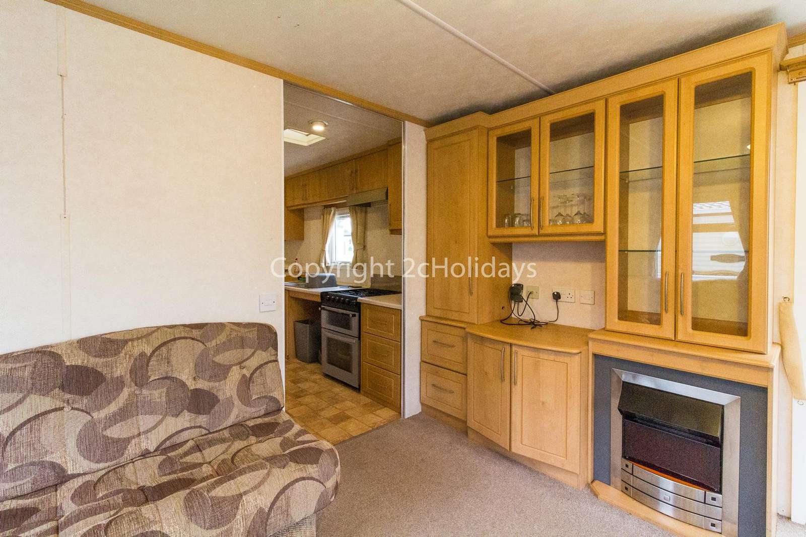Cosy feel to the lounge with an electric fire place and TV