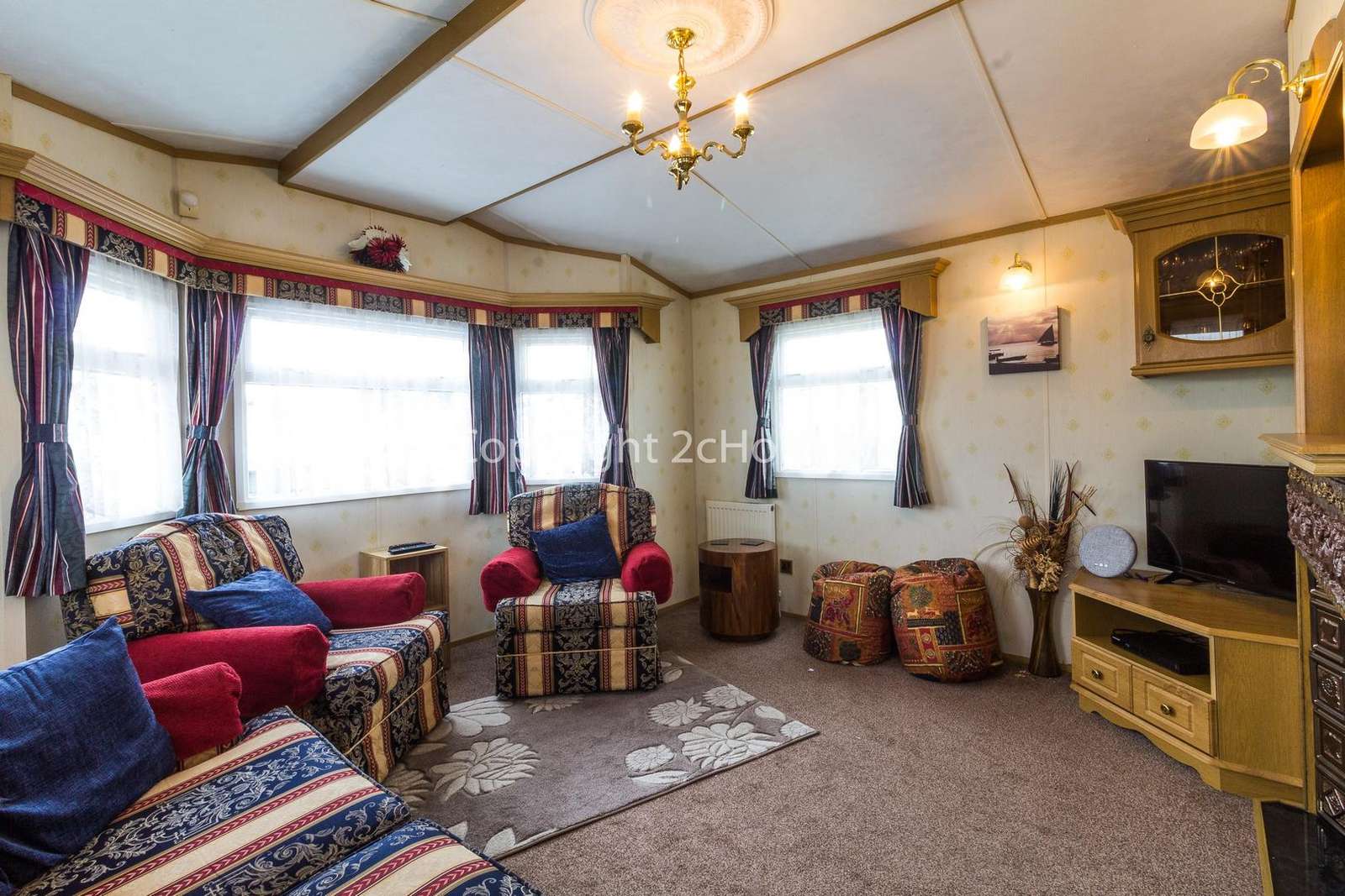 Cosy lounge area with a TV and electric fire!