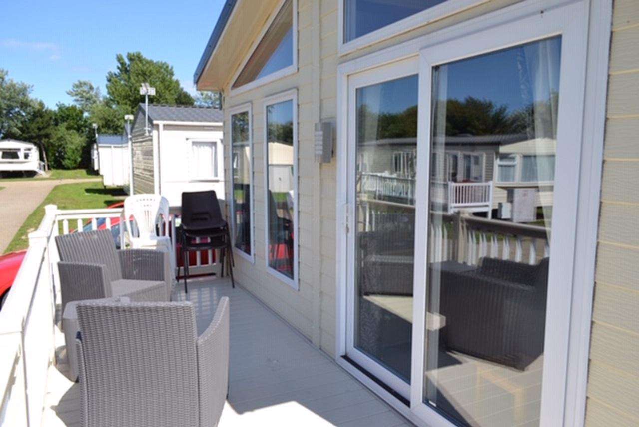 Relax and enjoy use of outdoor furniture on this large decked area