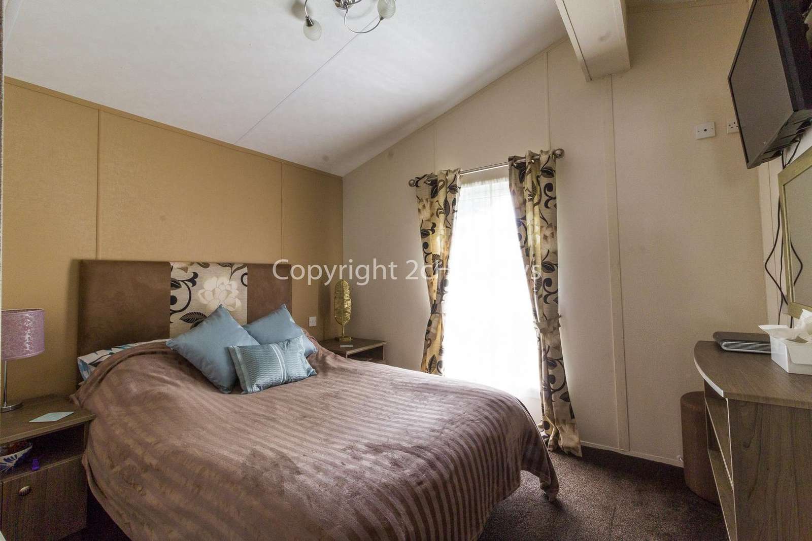 Great size master bedroom with a TV!