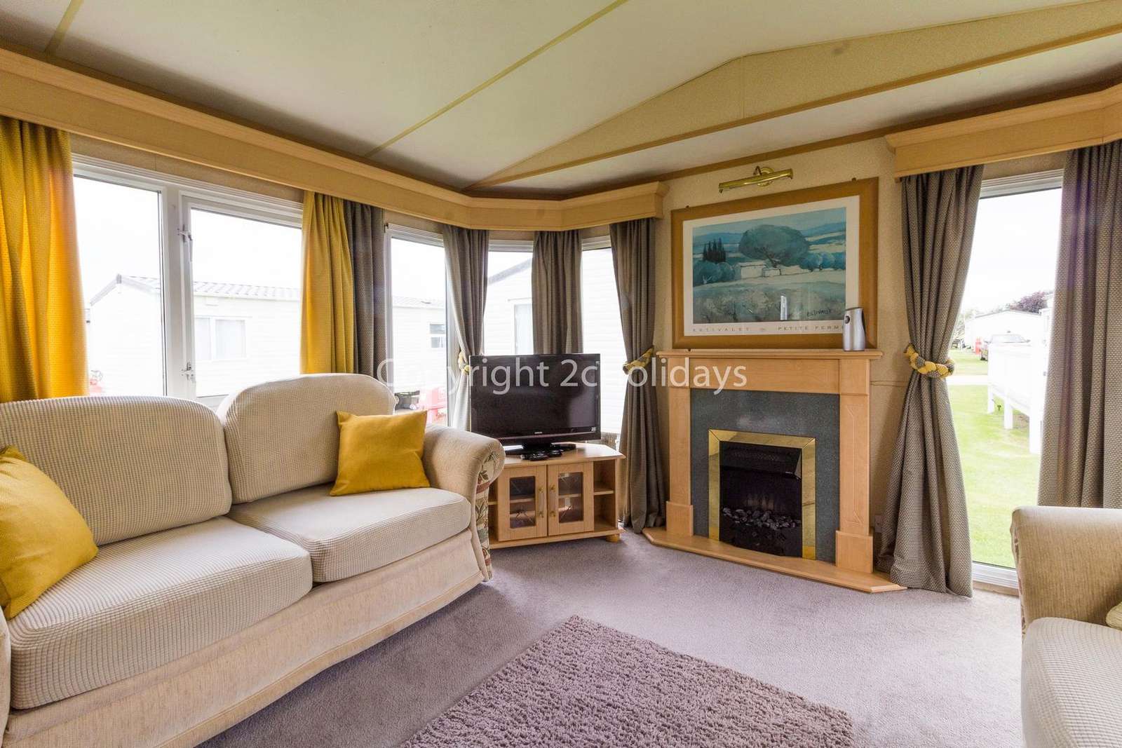 You can relax in this living area which comes with a TV and a gas fire