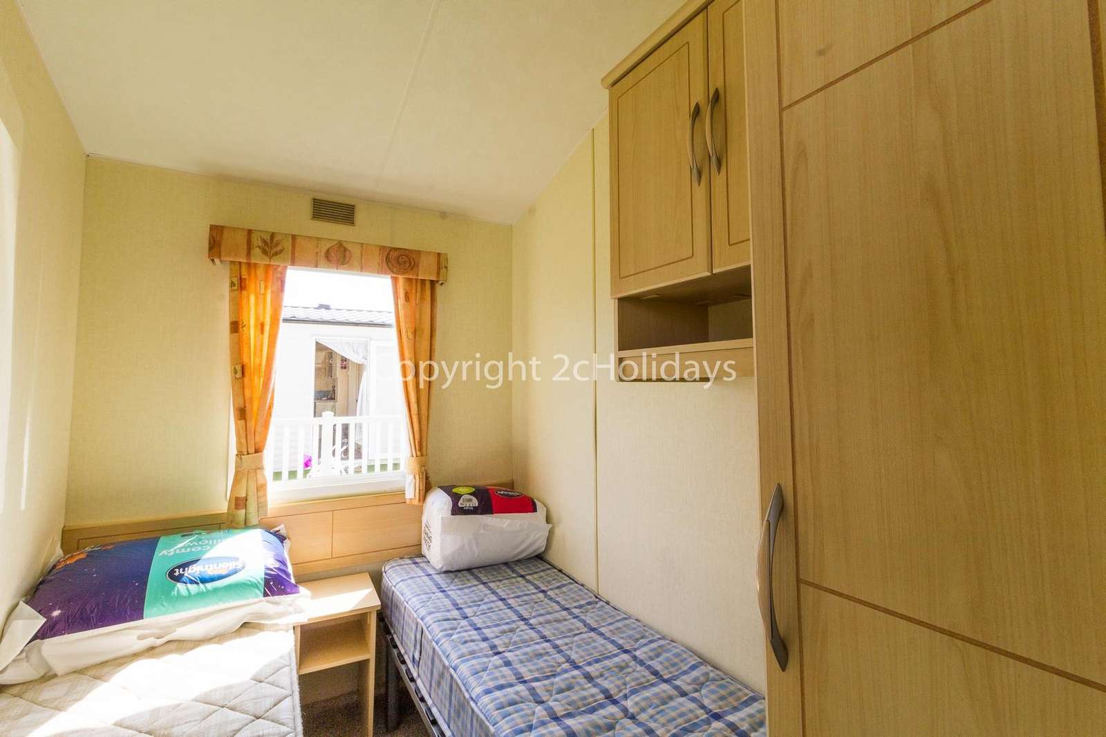 There's plenty of storage in this twin bedroom!