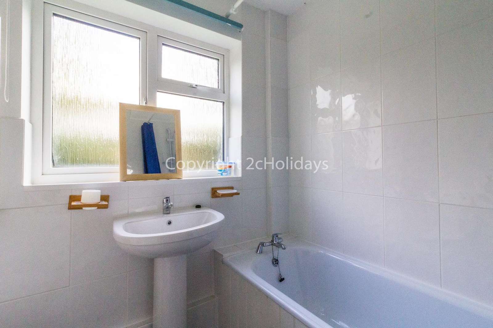 Spacious family washroom with a bath!