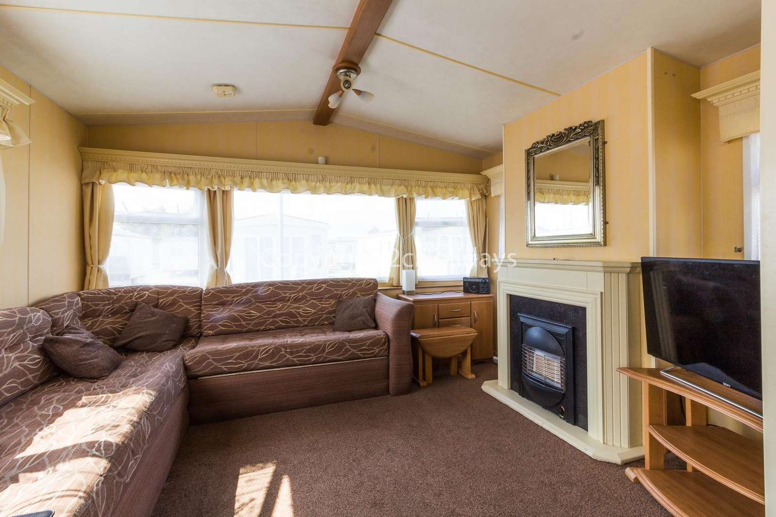 Cosy living area with a TV and gas fire