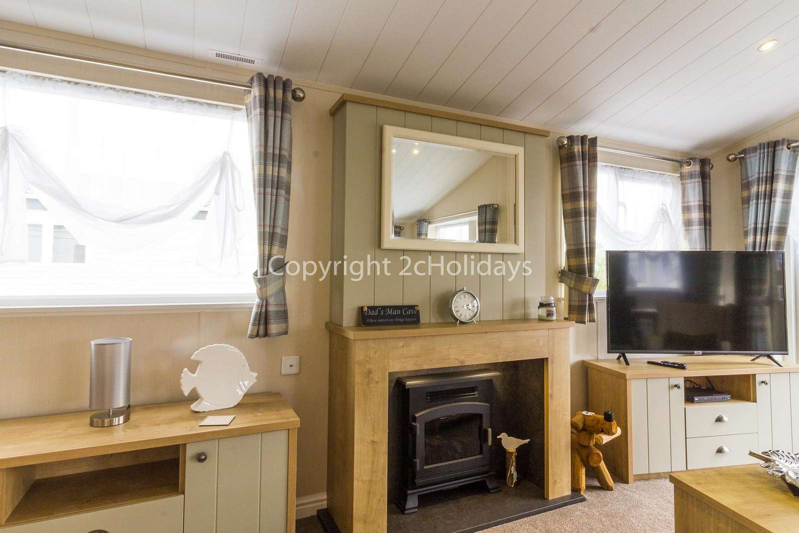 Homely lounge with a TV and electric log fire!