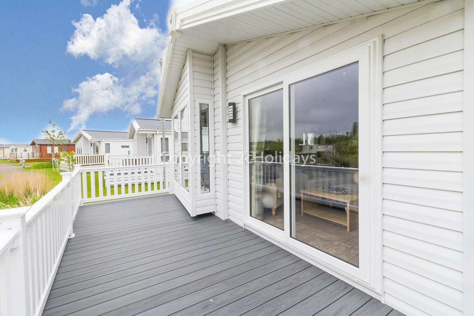 Large decking area with outdoor furniture including a BBQ!