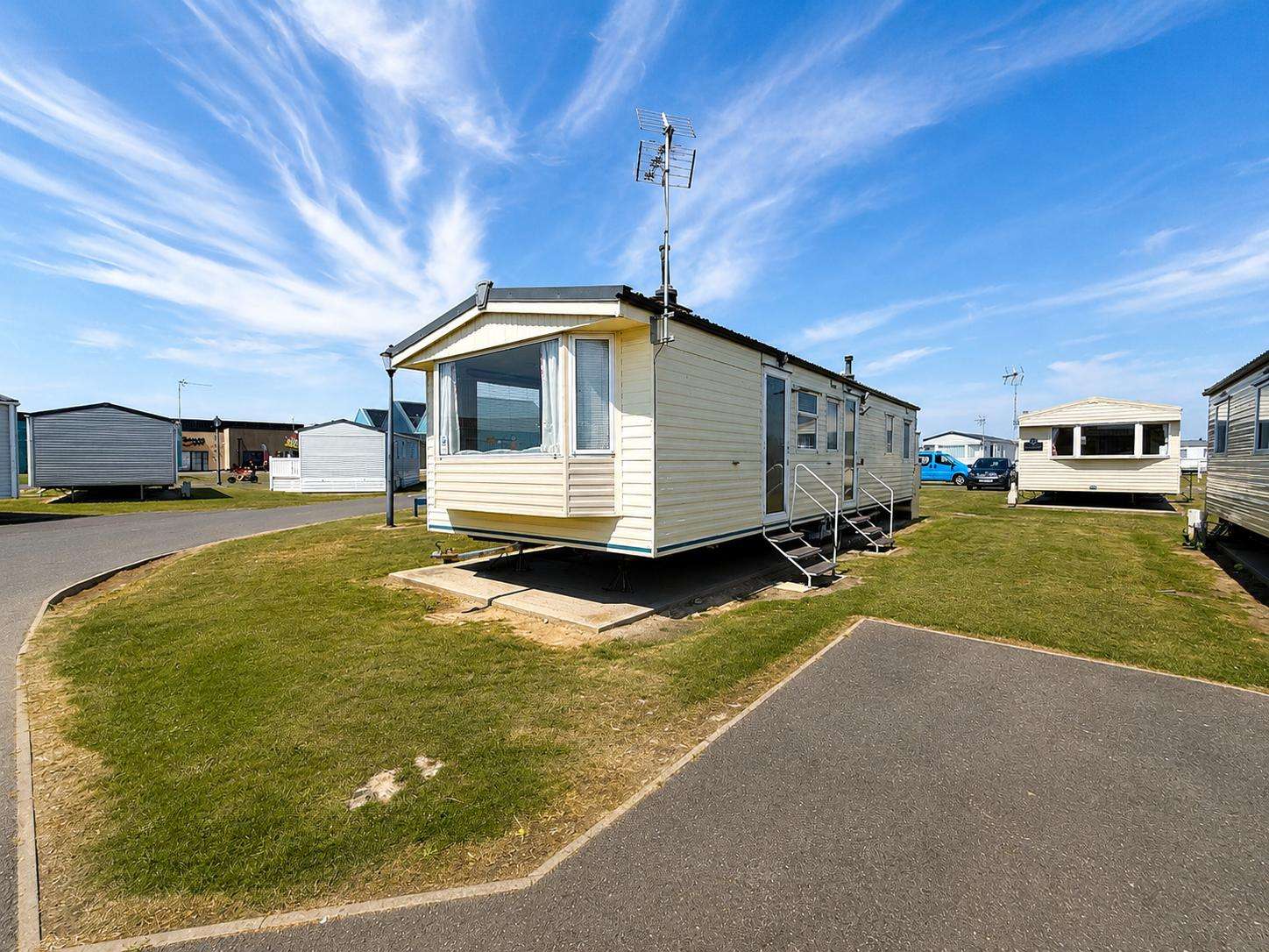 Enjoy a coastal getaway at St Osyth Beach & Martello Beach Holiday Park, complete with parking. - property