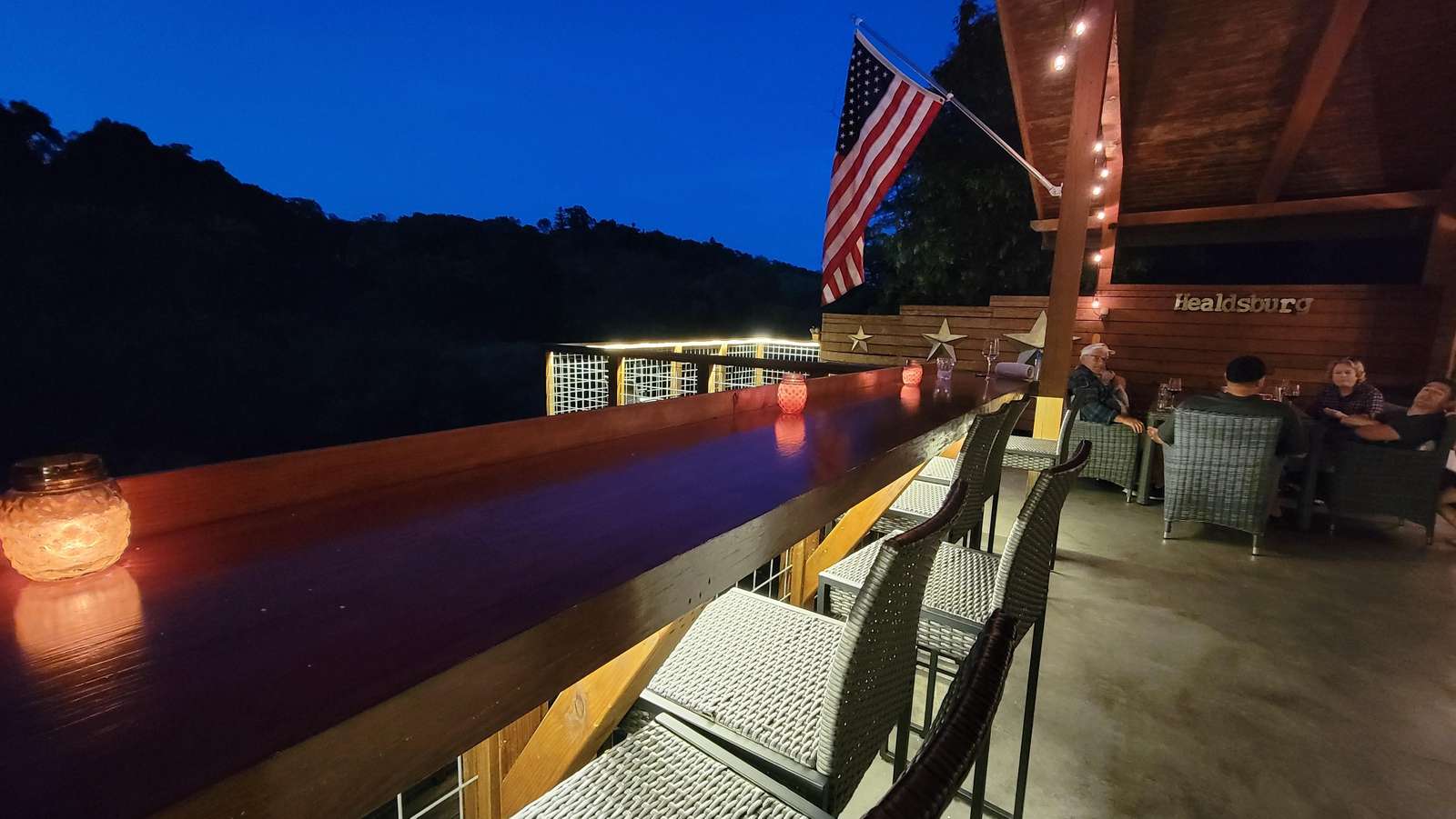 Cozy outdoor bar with stunning twilight mountain views - property