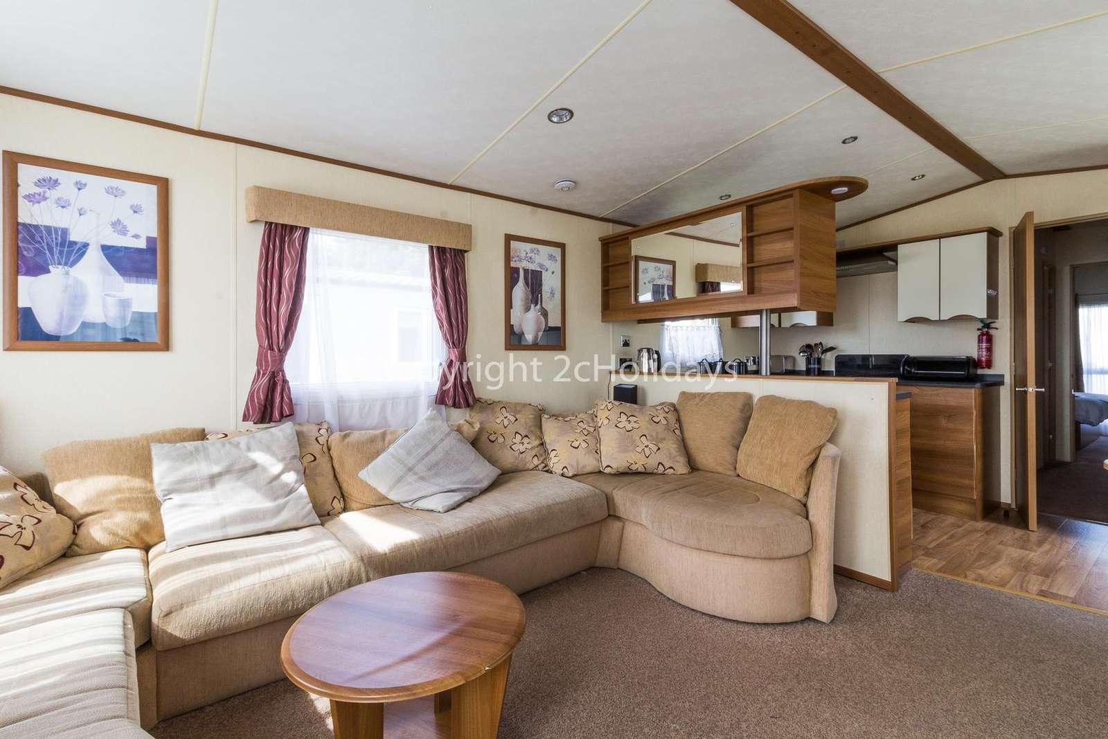 A homely lounge area leading to the kitchen