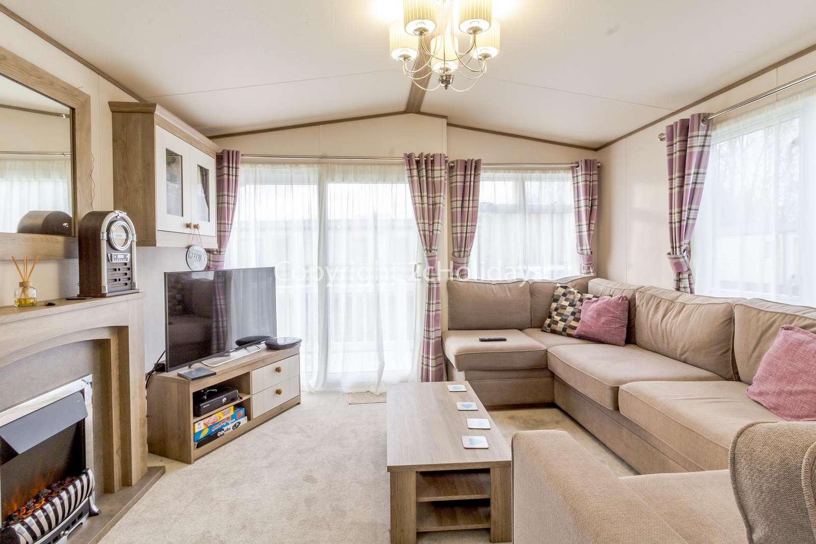 Cosy loving area with a TV and electric fire