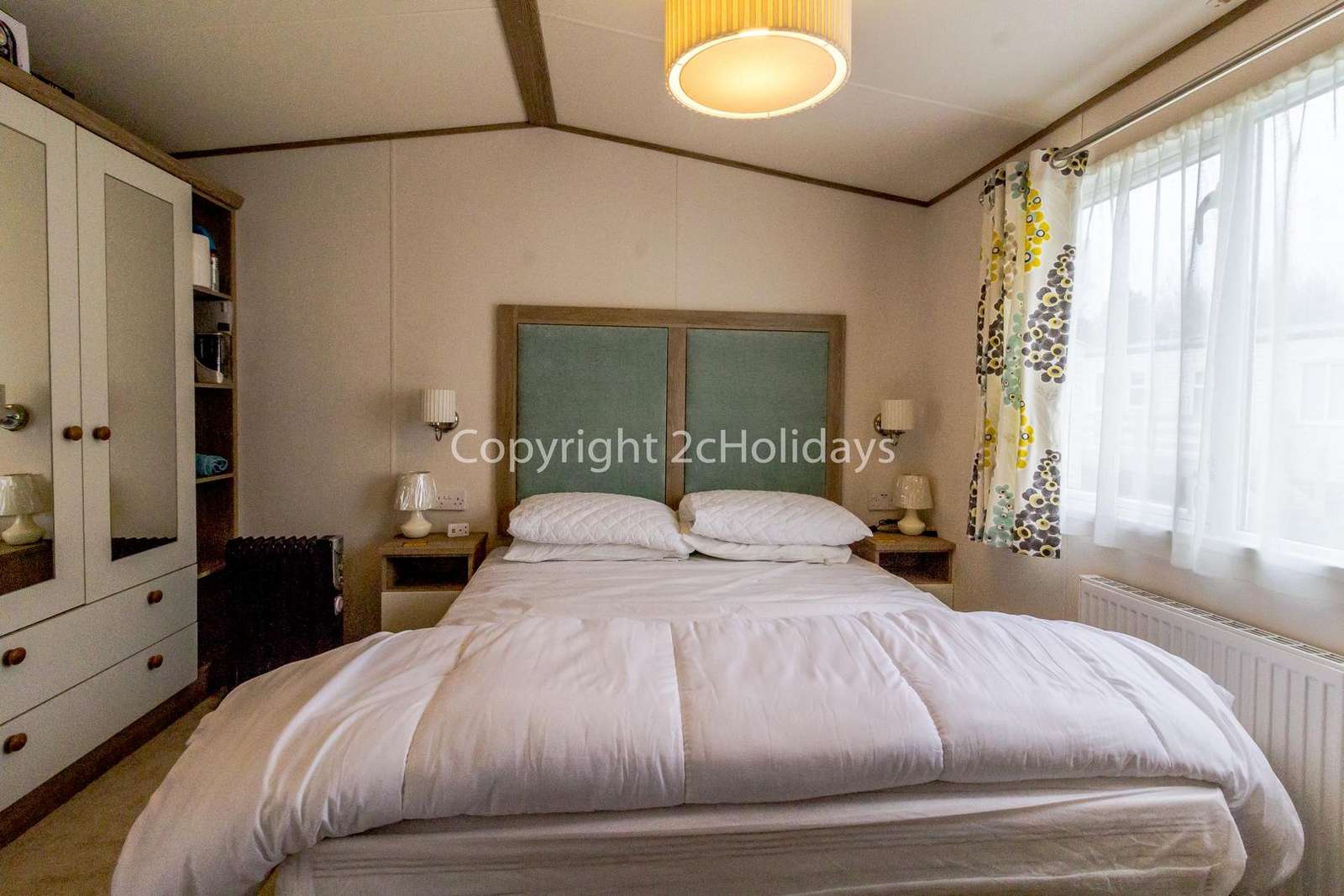 You can find plenty of storage space in this lovely master bedroom