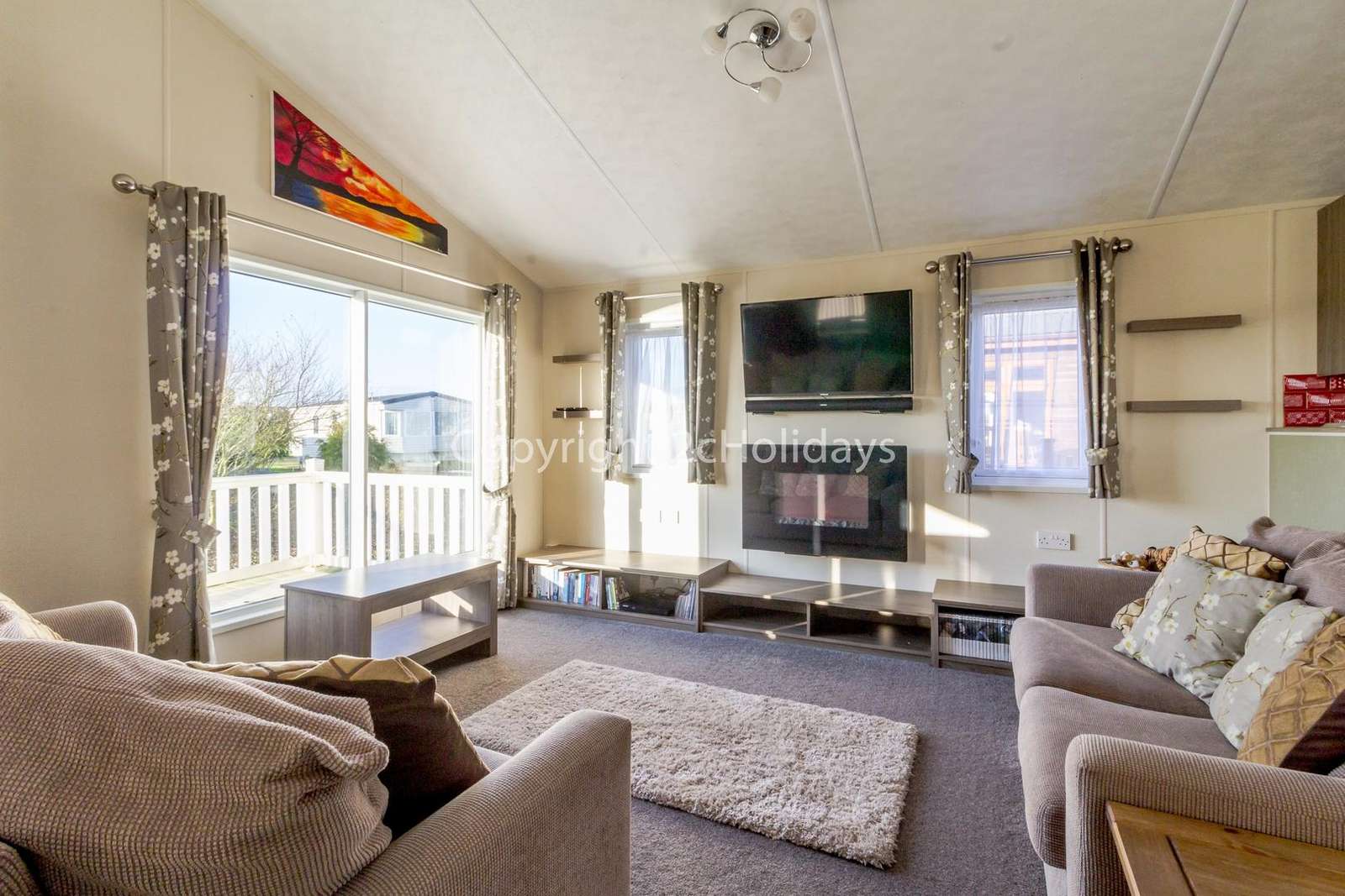 Cosy lounge with French doors leading onto the decking