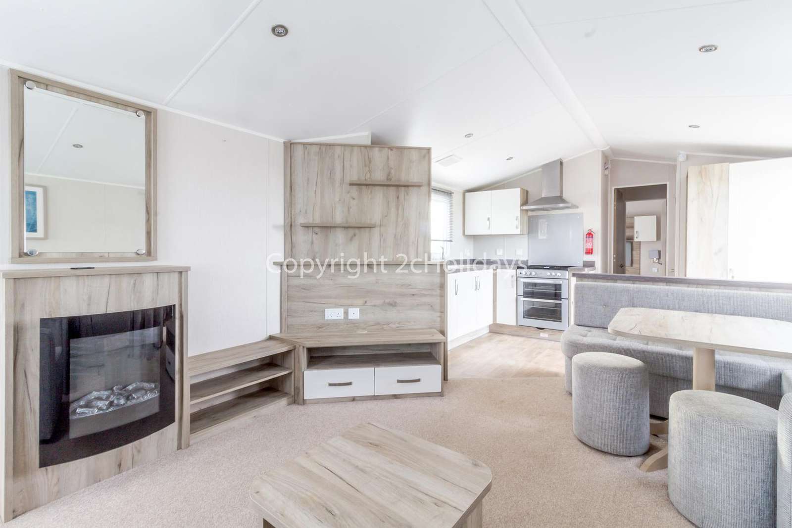Beautifully designed living/dining area and a kitchen with a electric fire